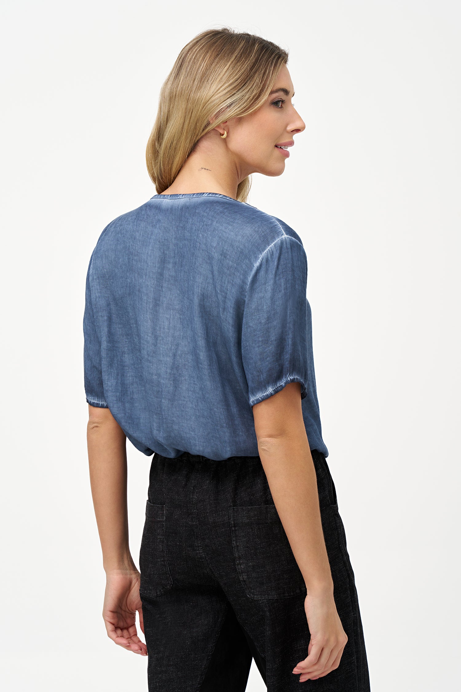 Short sleeve V-neck top in soft blue glacier with raw-edge detailing and chest pocket.