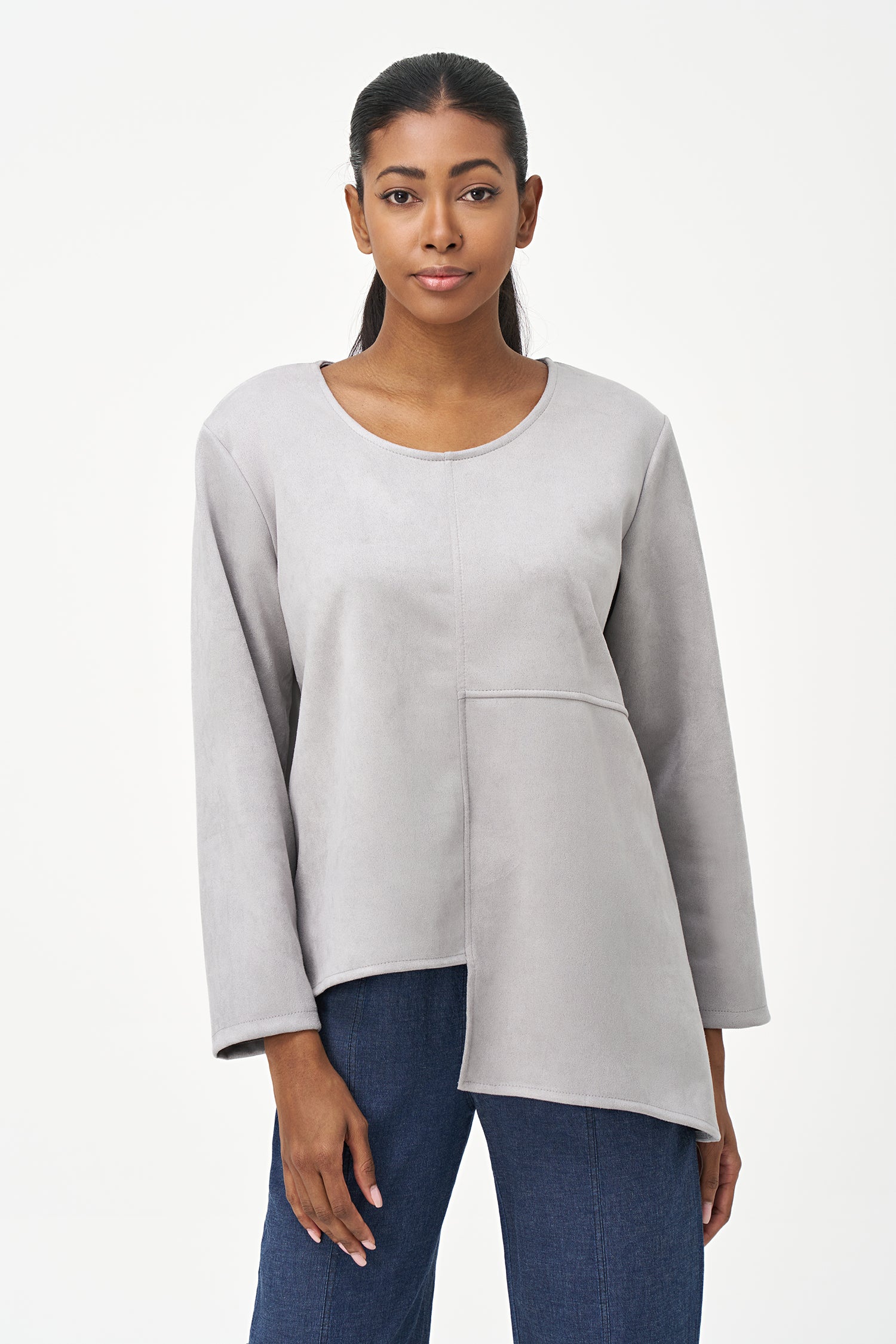 Grey faux suede long sleeve top with asymmetrical hem and front seam detailing.