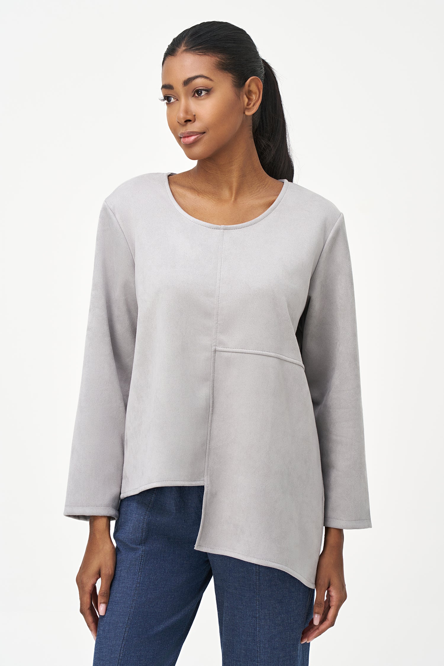 Grey faux suede long sleeve top with asymmetrical hem and front seam detailing.