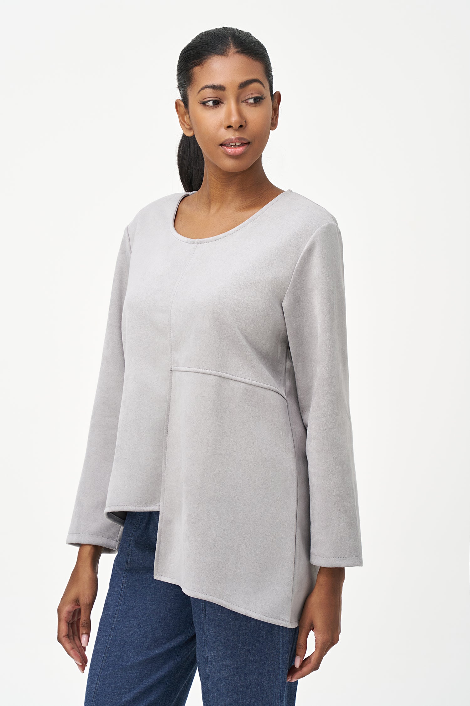 Grey faux suede long sleeve top with asymmetrical hem and front seam detailing.