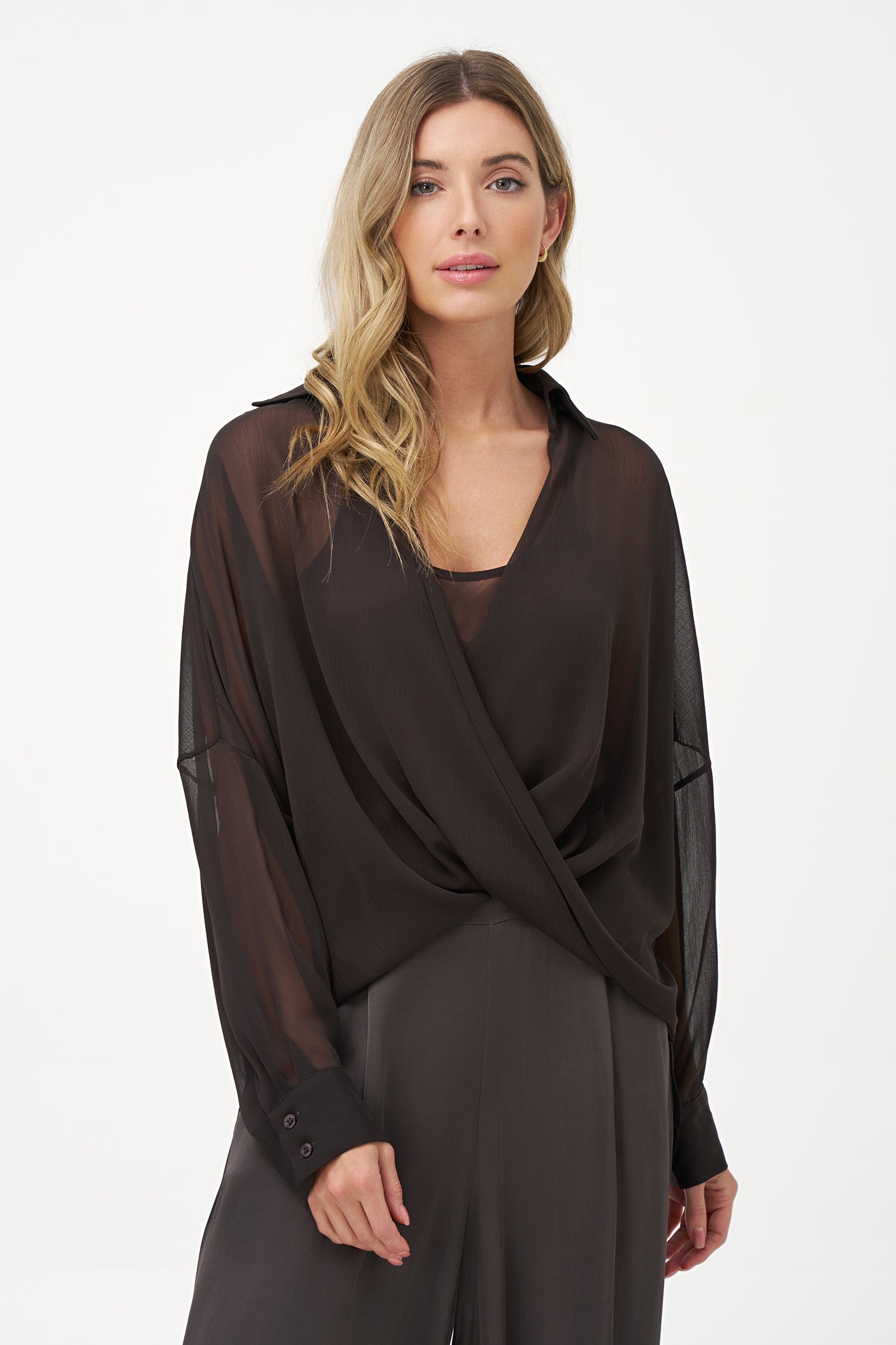 Brown sheer long-sleeve blouse with draped crossover front and inner tank layer