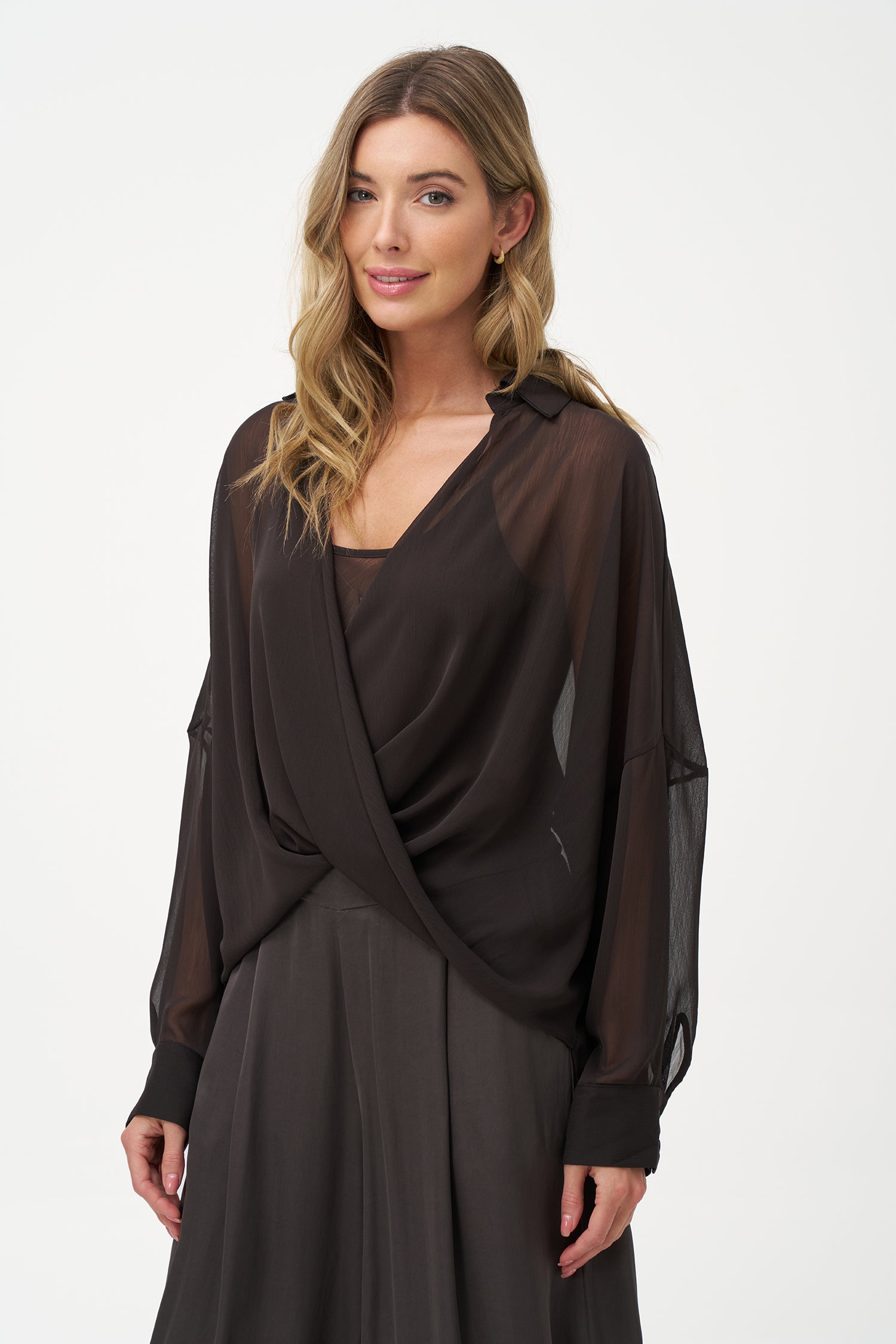 Brown sheer long-sleeve blouse with draped crossover front and inner tank layer