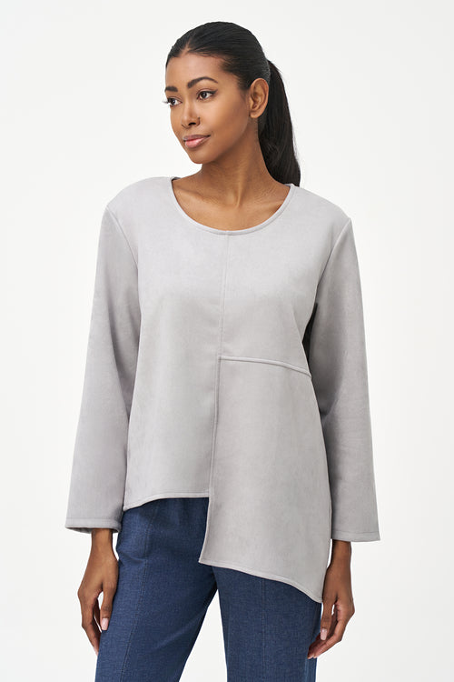 Grey faux suede long sleeve top with asymmetrical hem and front seam detailing.