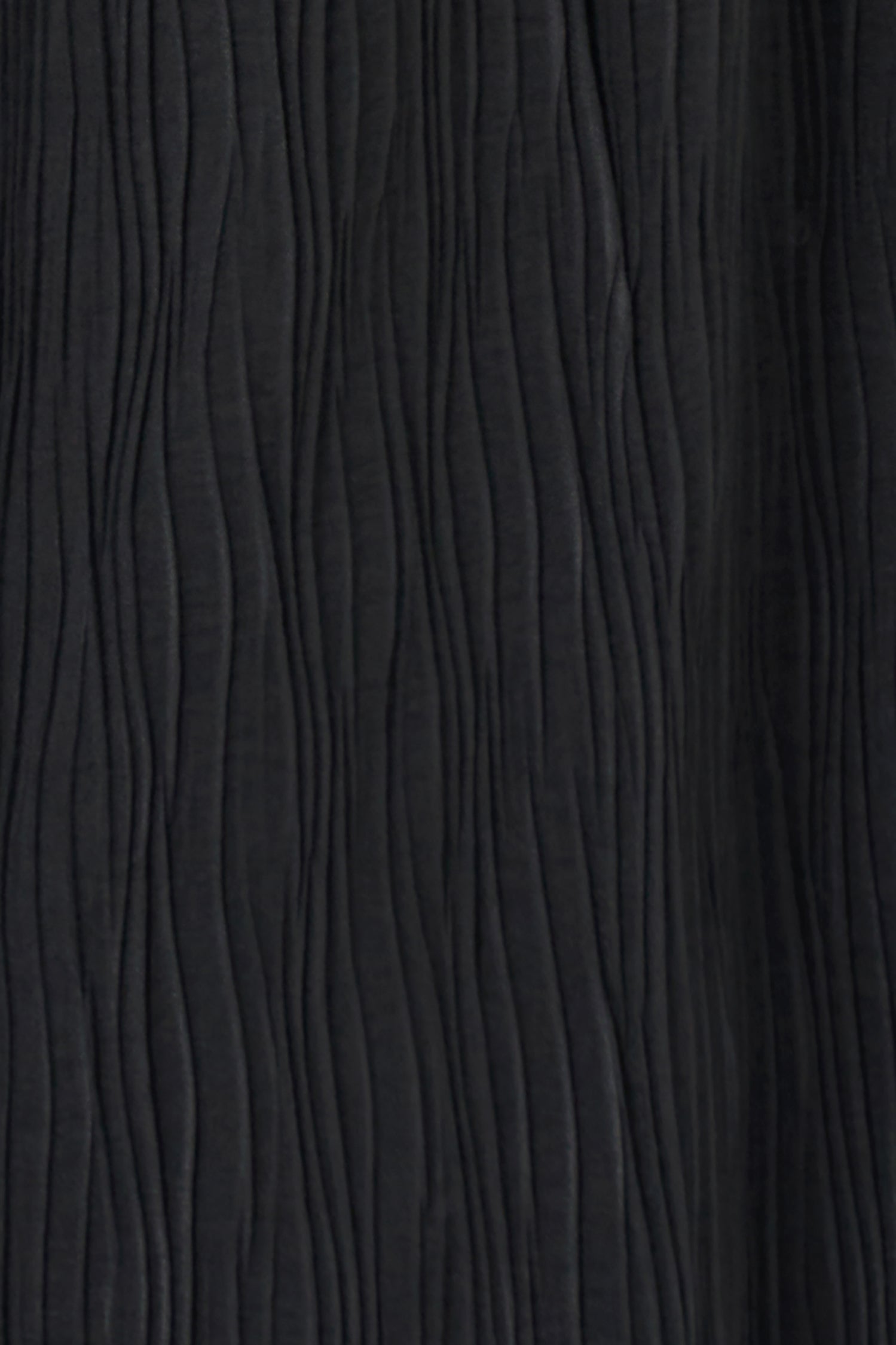 Black wide-leg crinkle pants with an elastic waistband and subtle wave texture, featuring a soft drape and flowy silhouette.