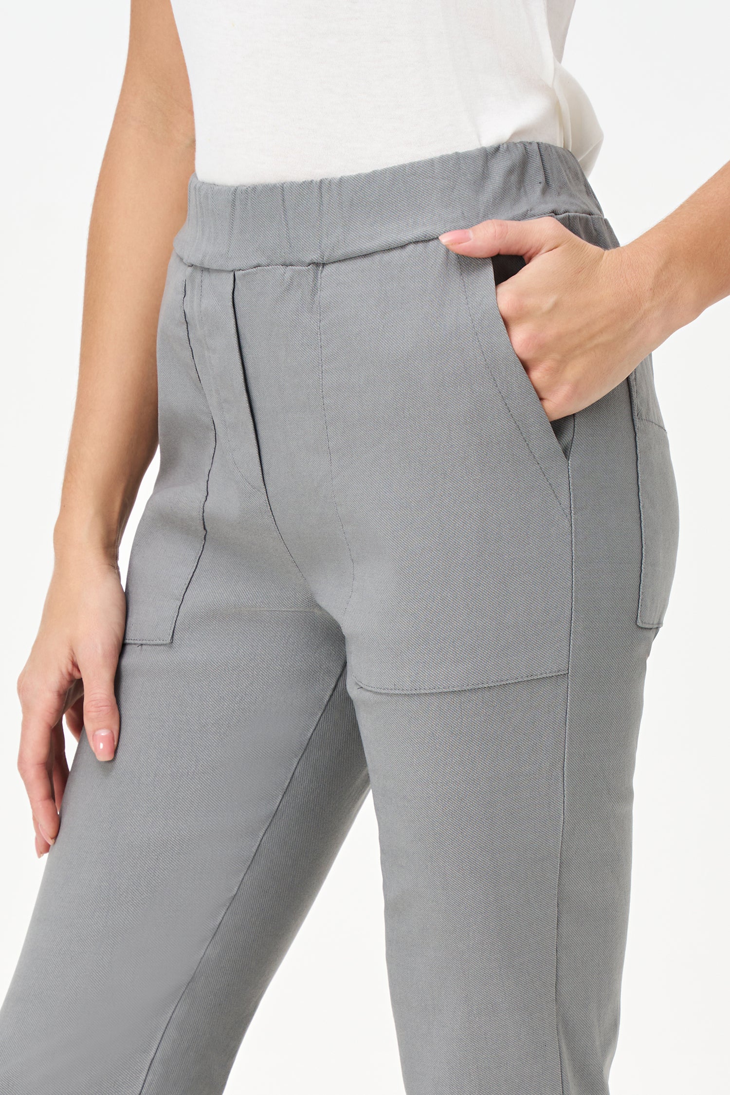 Slim-fit gray pants with wide front pockets, ankle-length cut, and soft stretch viscose blend for modern comfort.