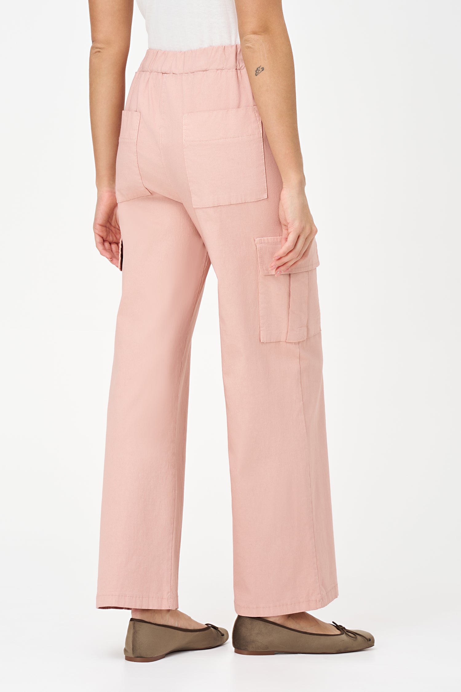 Pink cargo-style pants with flap side pockets, straight-leg cut, and soft stretch viscose blend for practical elegance.