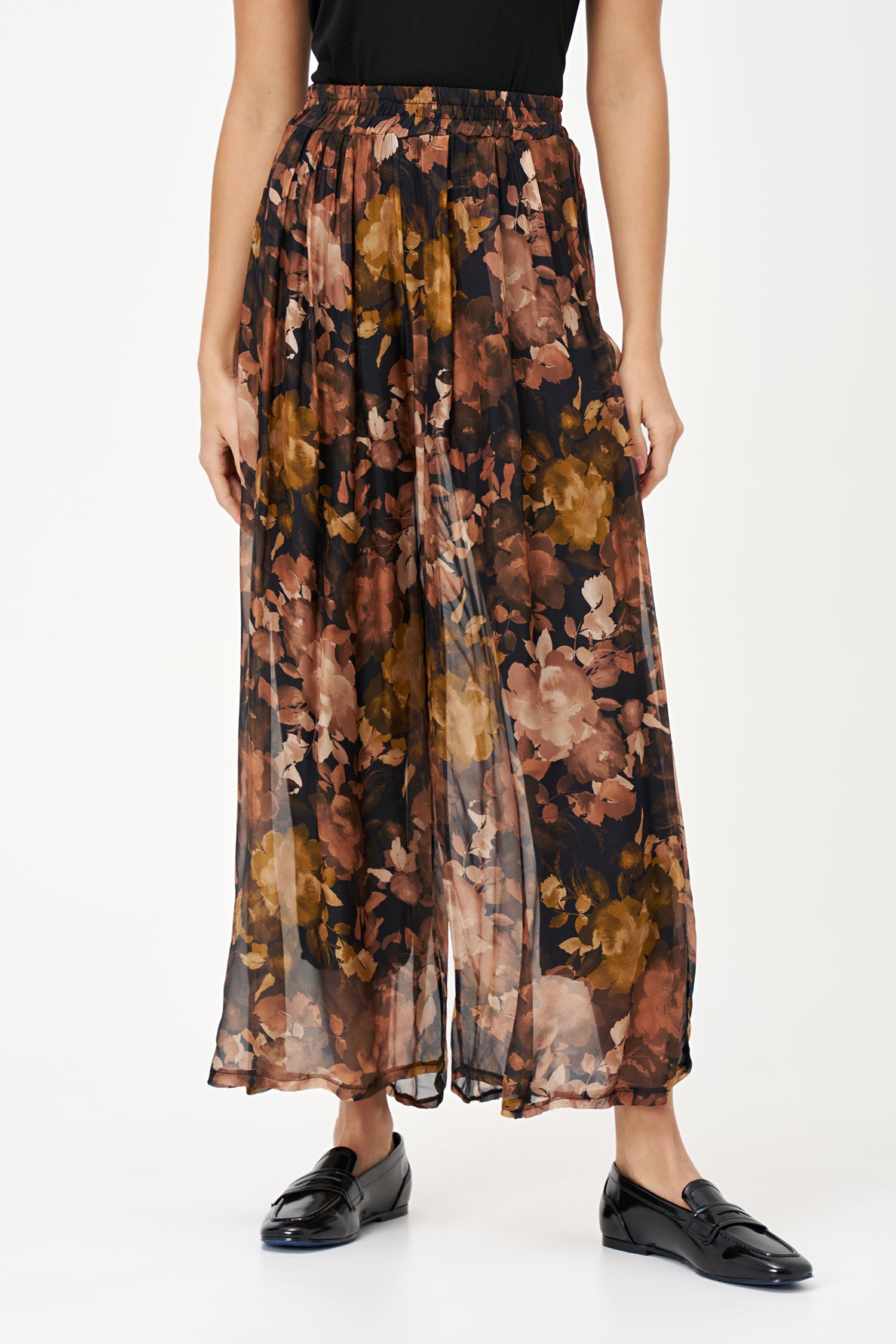 Sheer wide-leg pants in floral black Daphne print with flowy silk-viscose blend, ideal for garden parties or summer evenings.