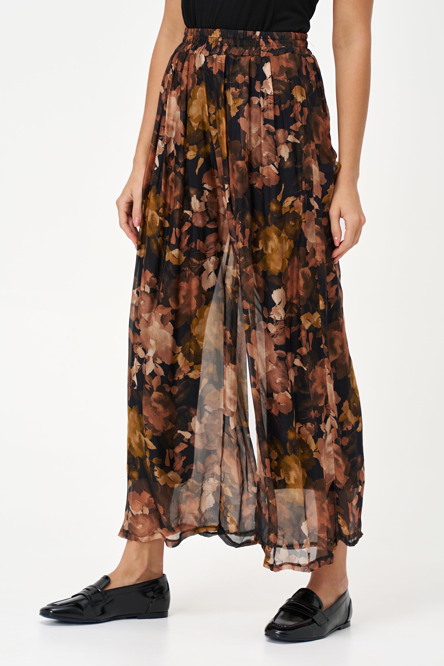 Sheer wide-leg pants in floral black Daphne print with flowy silk-viscose blend, ideal for garden parties or summer evenings.