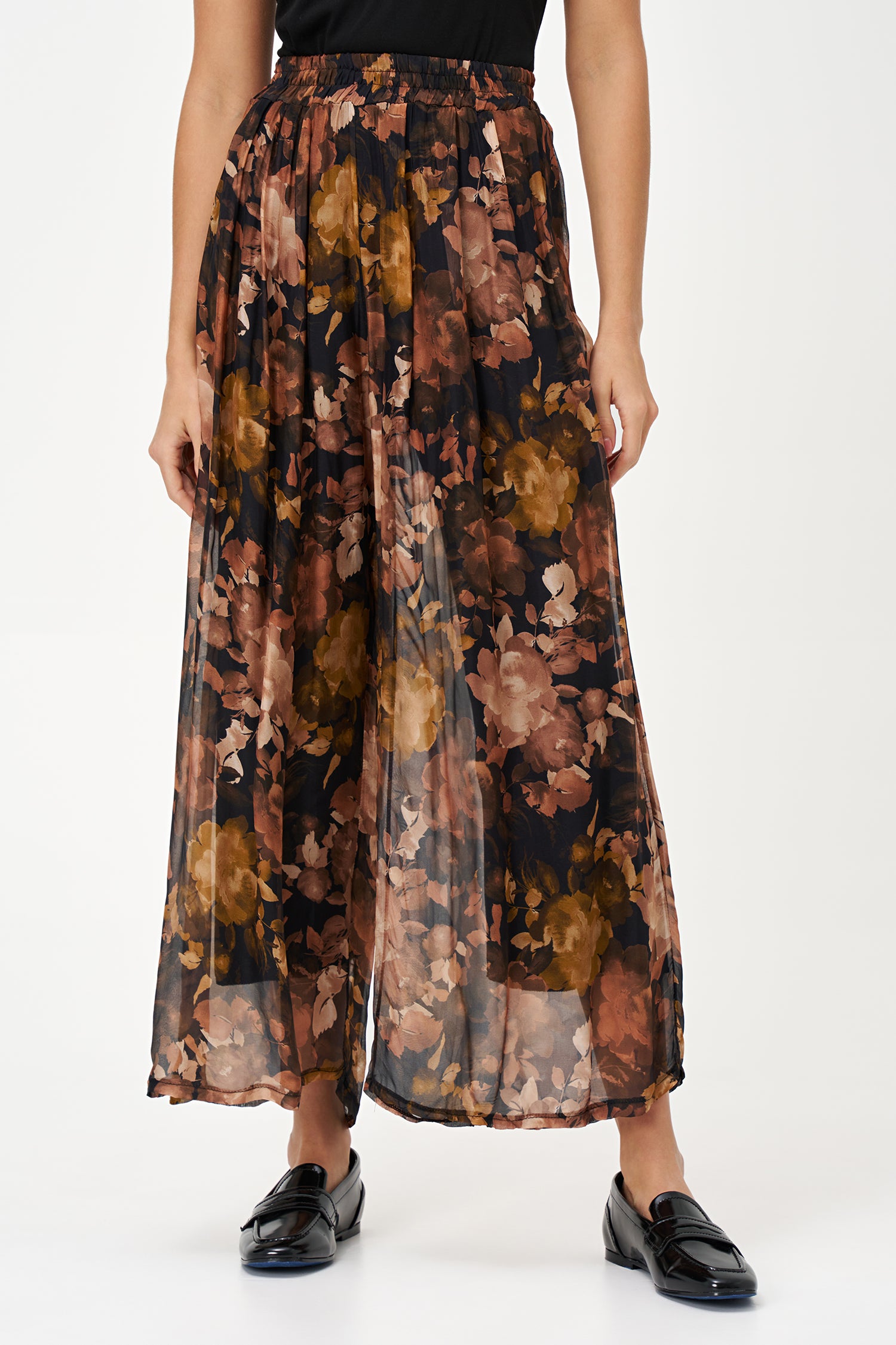 Sheer wide-leg pants in floral black Daphne print with flowy silk-viscose blend, ideal for garden parties or summer evenings.