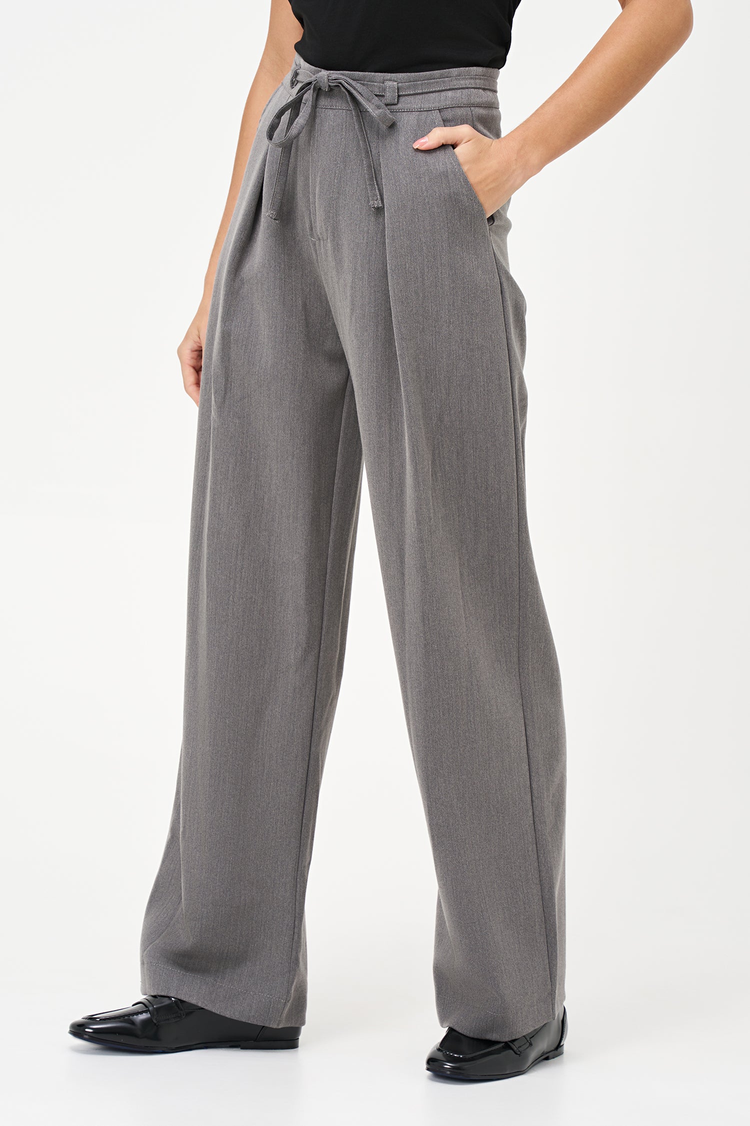 Gray tailored pants with pleated front and adjustable waist tie, crafted from a soft polyester-viscose blend.