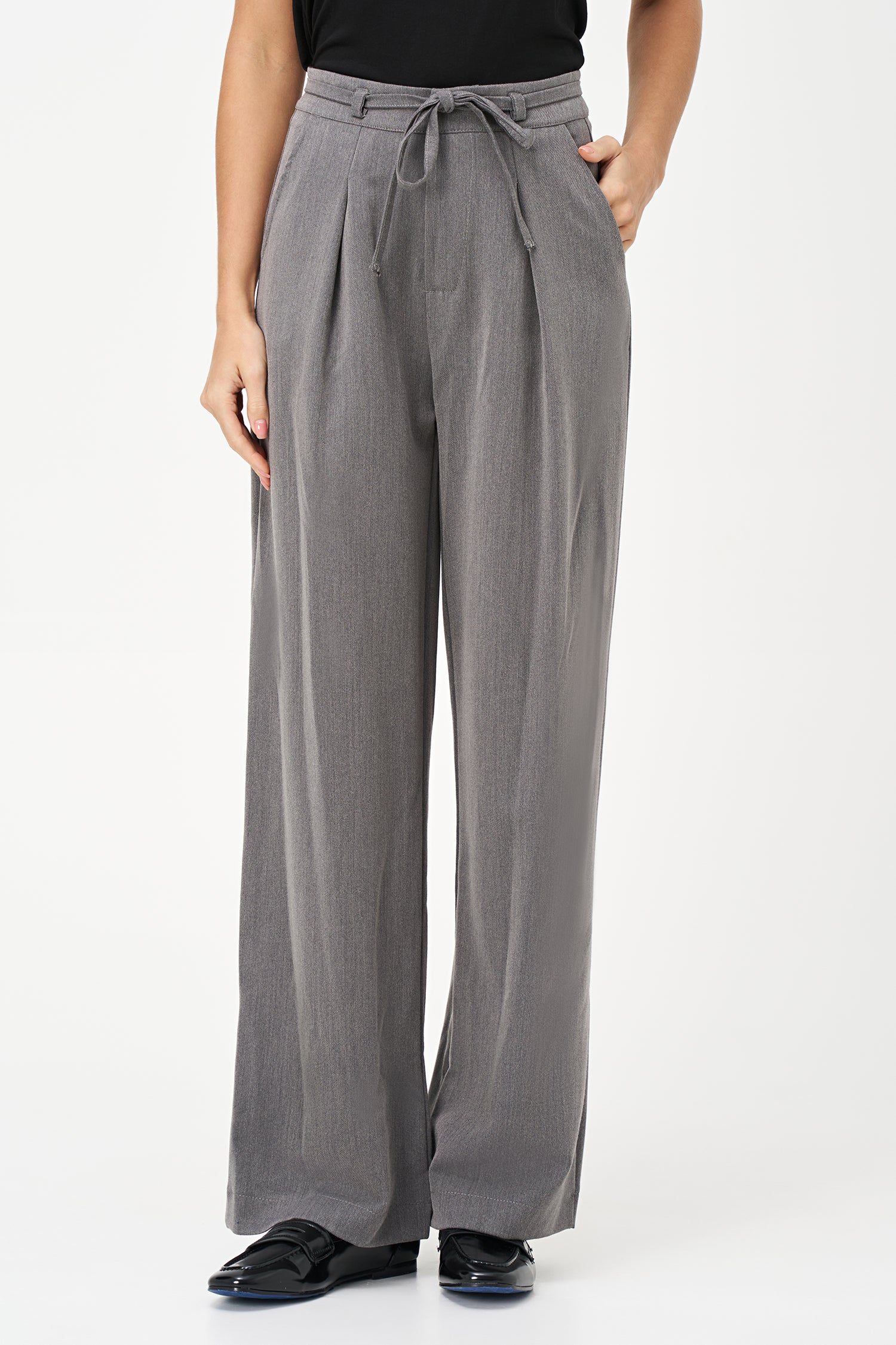 Gray tailored pants with pleated front and adjustable waist tie, crafted from a soft polyester-viscose blend.