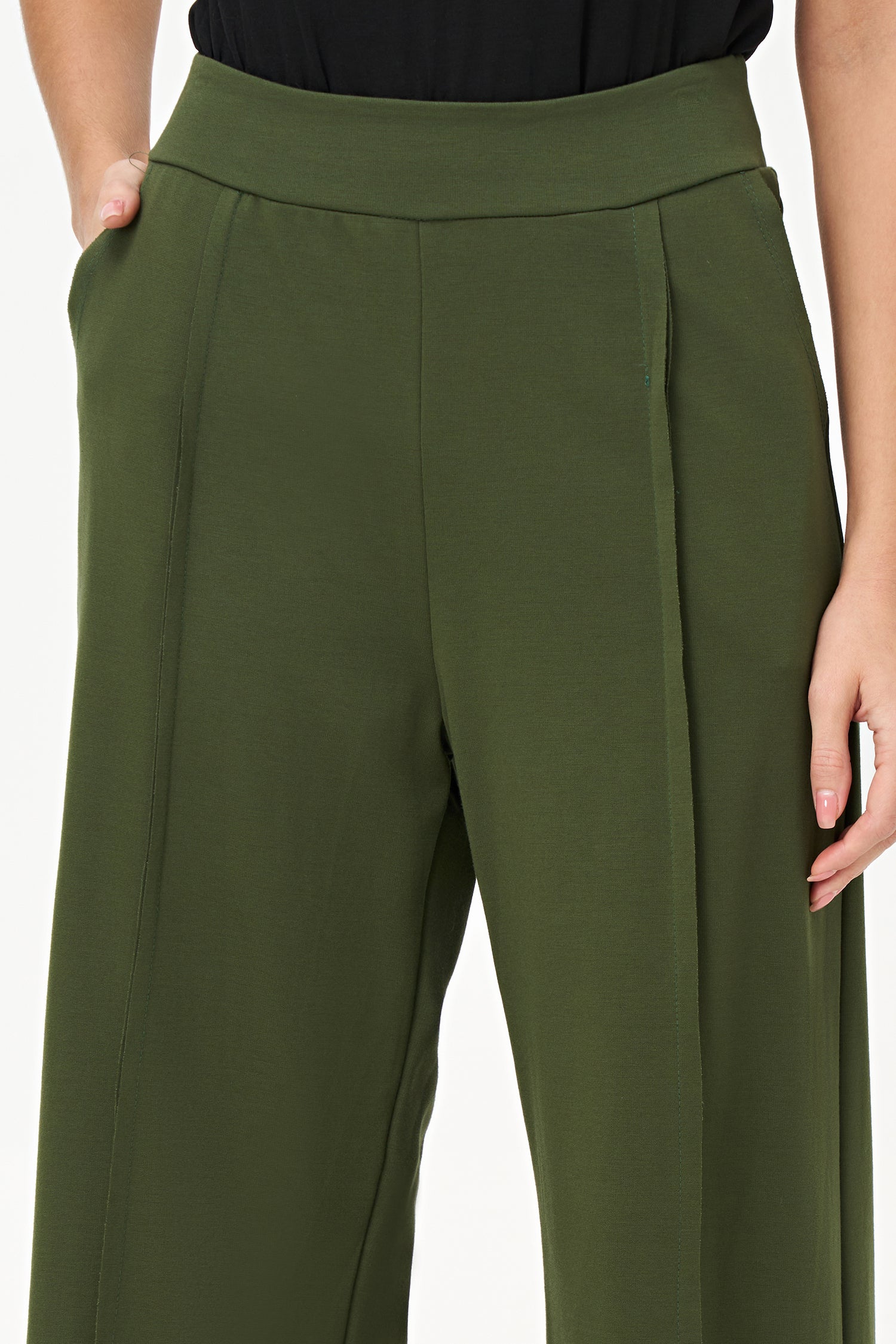 Bonsai flared pants with structured front seams and wide waistband, made from cotton-nylon stretch fabric.