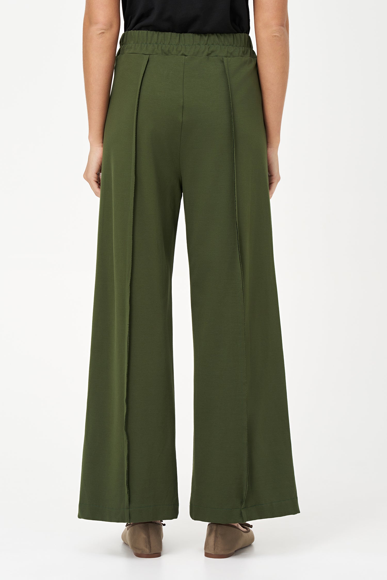 Bonsai flared pants with structured front seams and wide waistband, made from cotton-nylon stretch fabric.