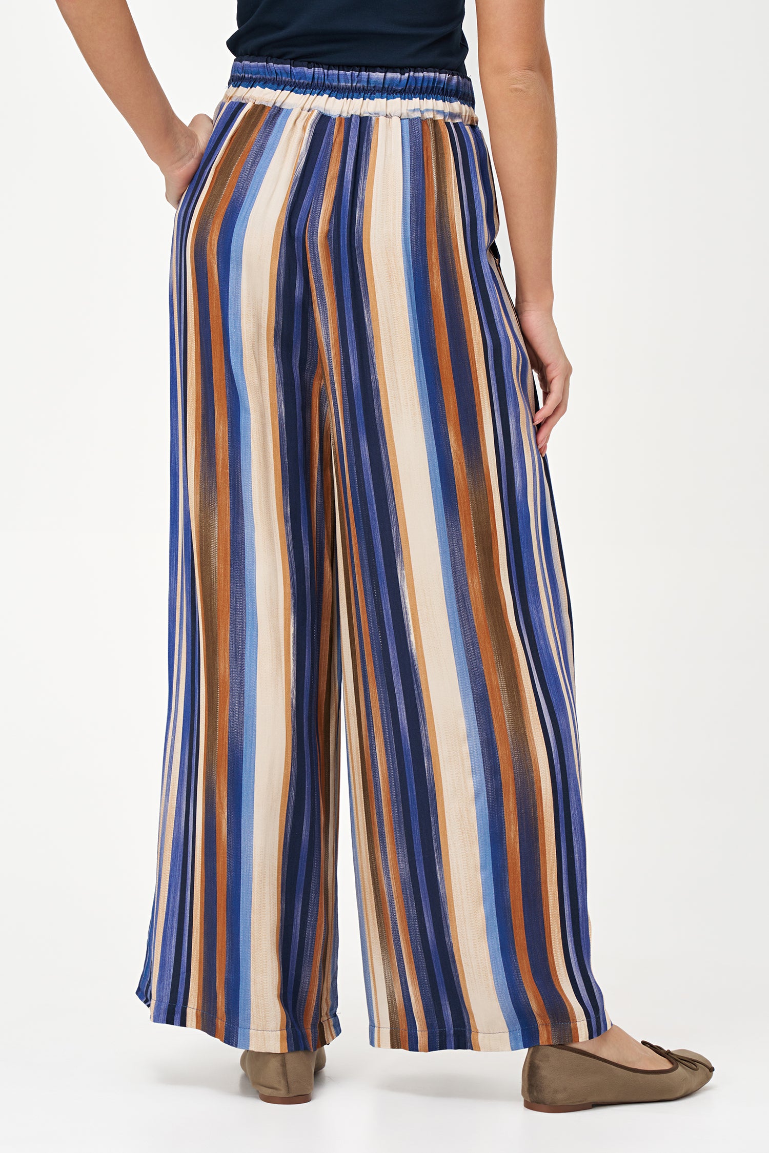 Colorful wide-leg pants in Blue Stripes print with an airy viscose drape, perfect for travel or warm-weather styling.