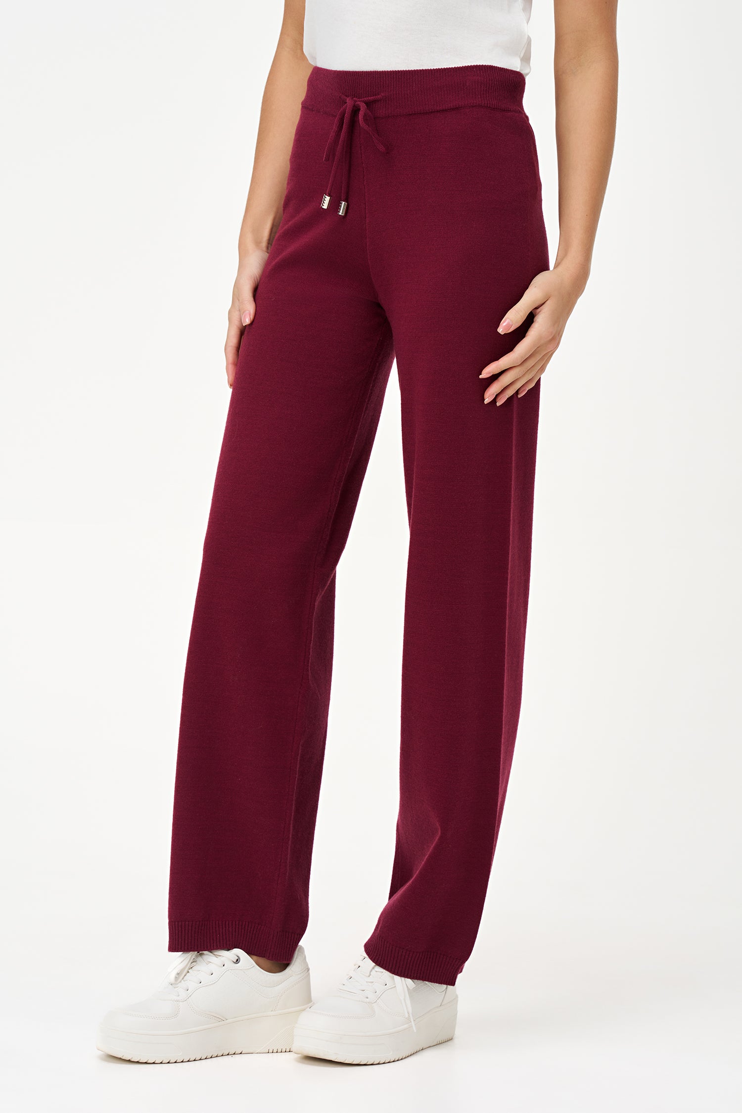 Red knit jogger pants with drawstring waist and cuffed hem, crafted in a soft rayon-blend for cozy everyday wear.