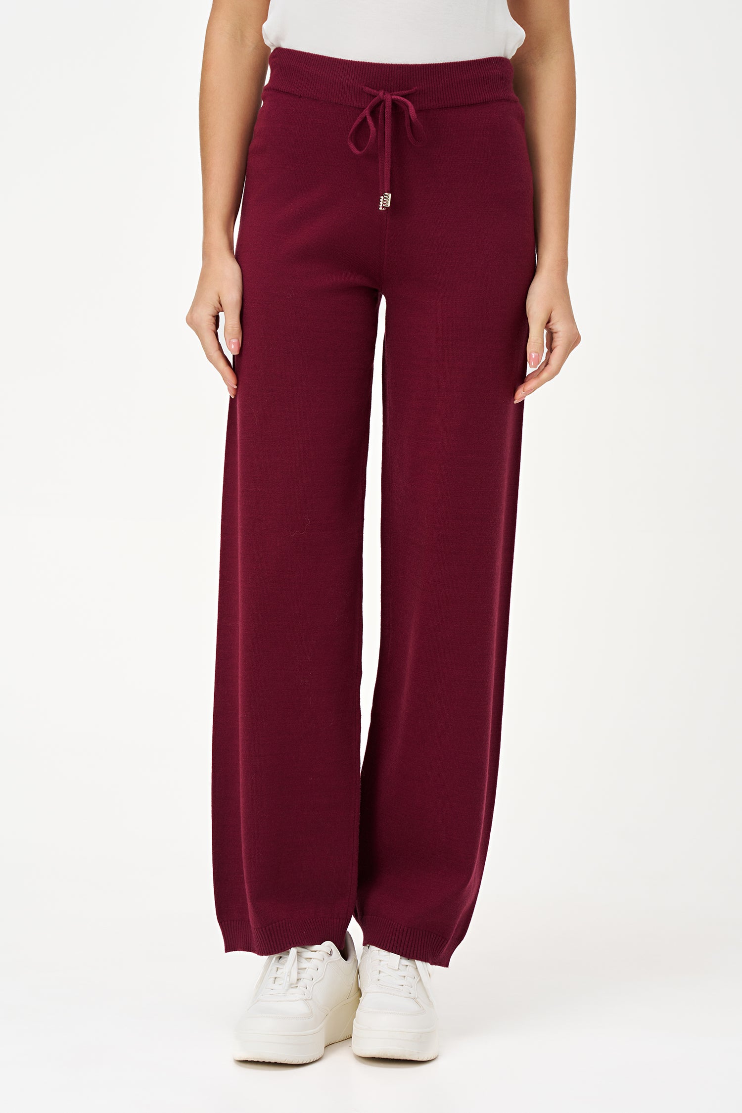 Red knit jogger pants with drawstring waist and cuffed hem, crafted in a soft rayon-blend for cozy everyday wear.