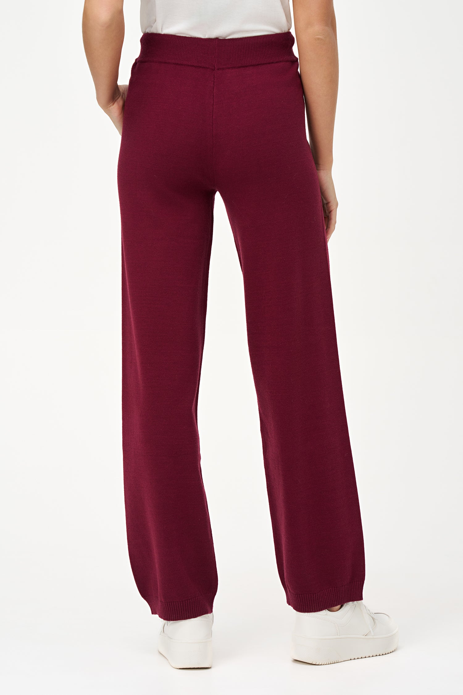 Red knit jogger pants with drawstring waist and cuffed hem, crafted in a soft rayon-blend for cozy everyday wear.