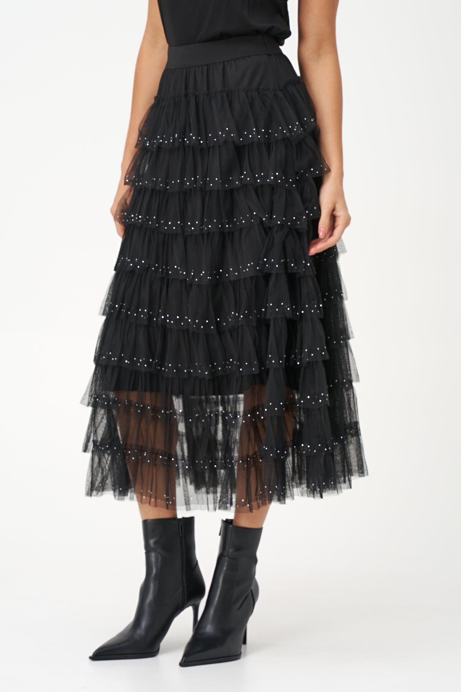 Black layered tulle maxi skirt with ruffled tiers and subtle sparkle embellishments, perfect for special occasions or evening wear.