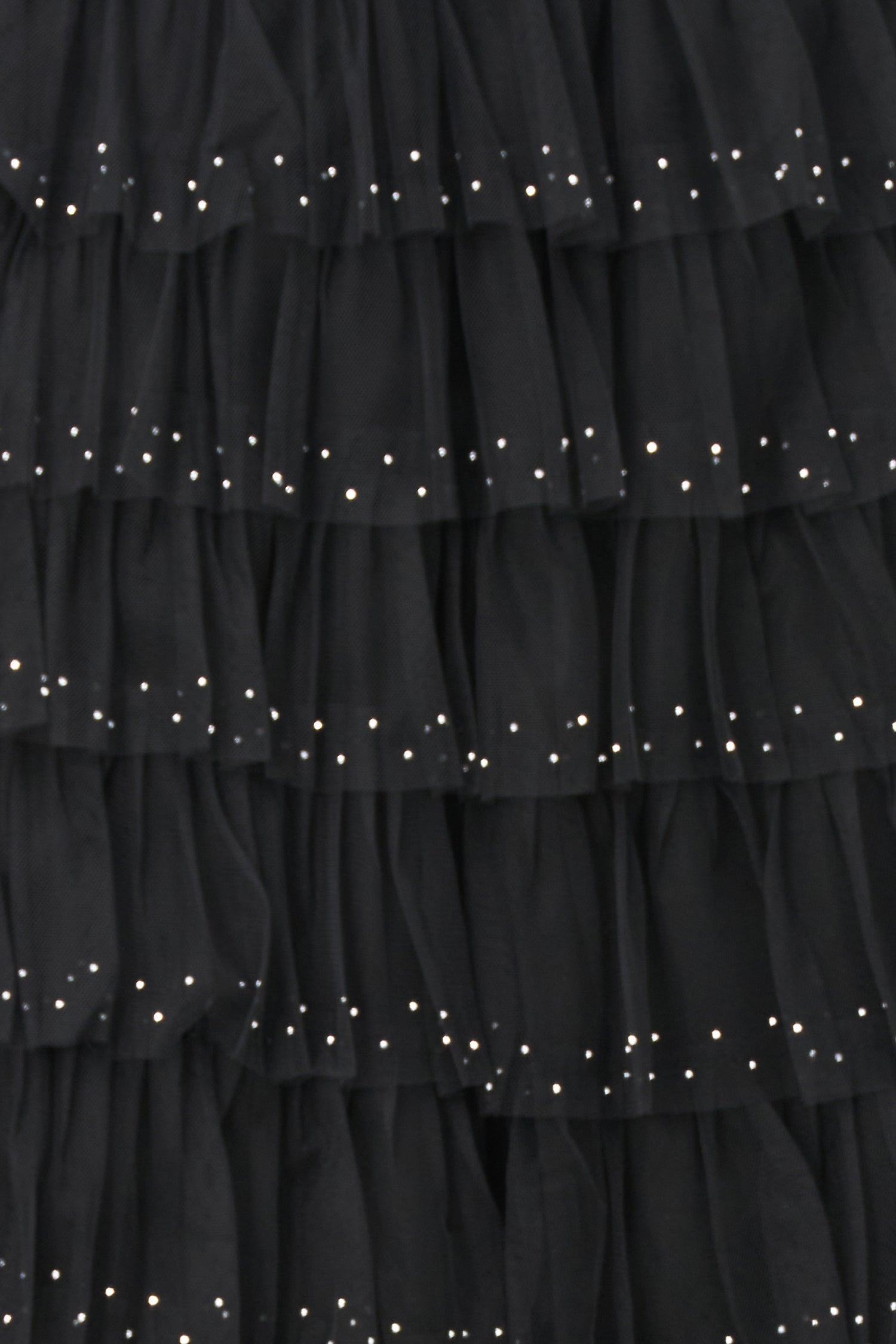 Black layered tulle maxi skirt with ruffled tiers and subtle sparkle embellishments, perfect for special occasions or evening wear.