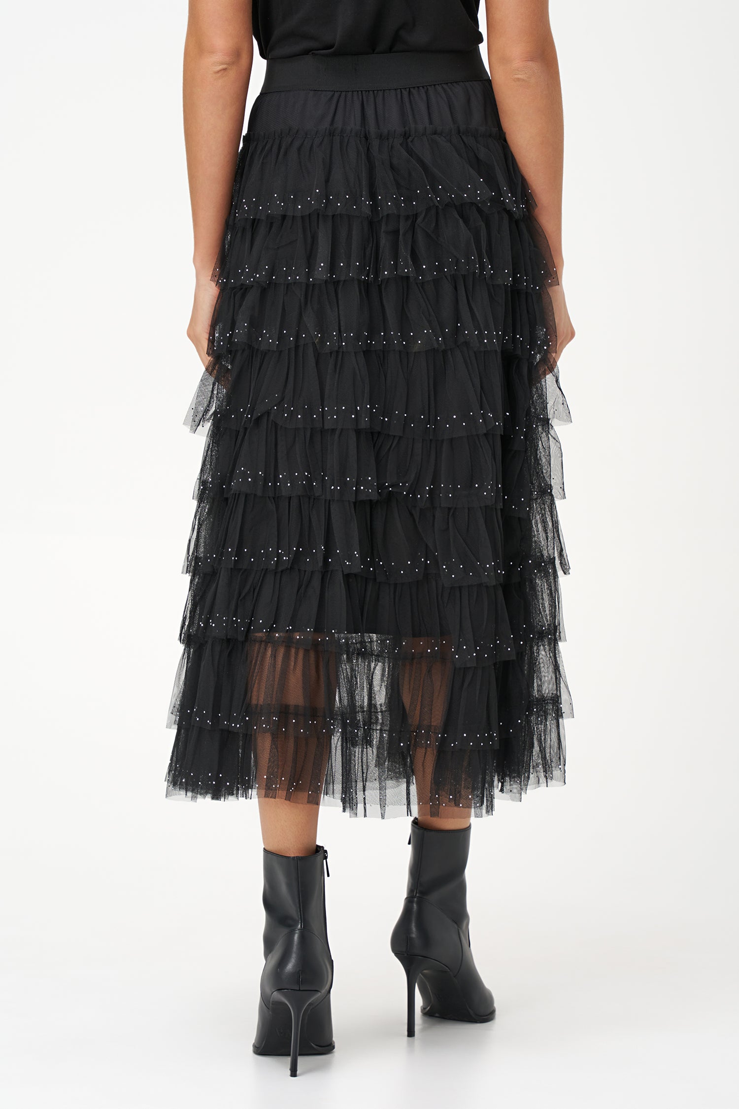 Black layered tulle maxi skirt with ruffled tiers and subtle sparkle embellishments, perfect for special occasions or evening wear.