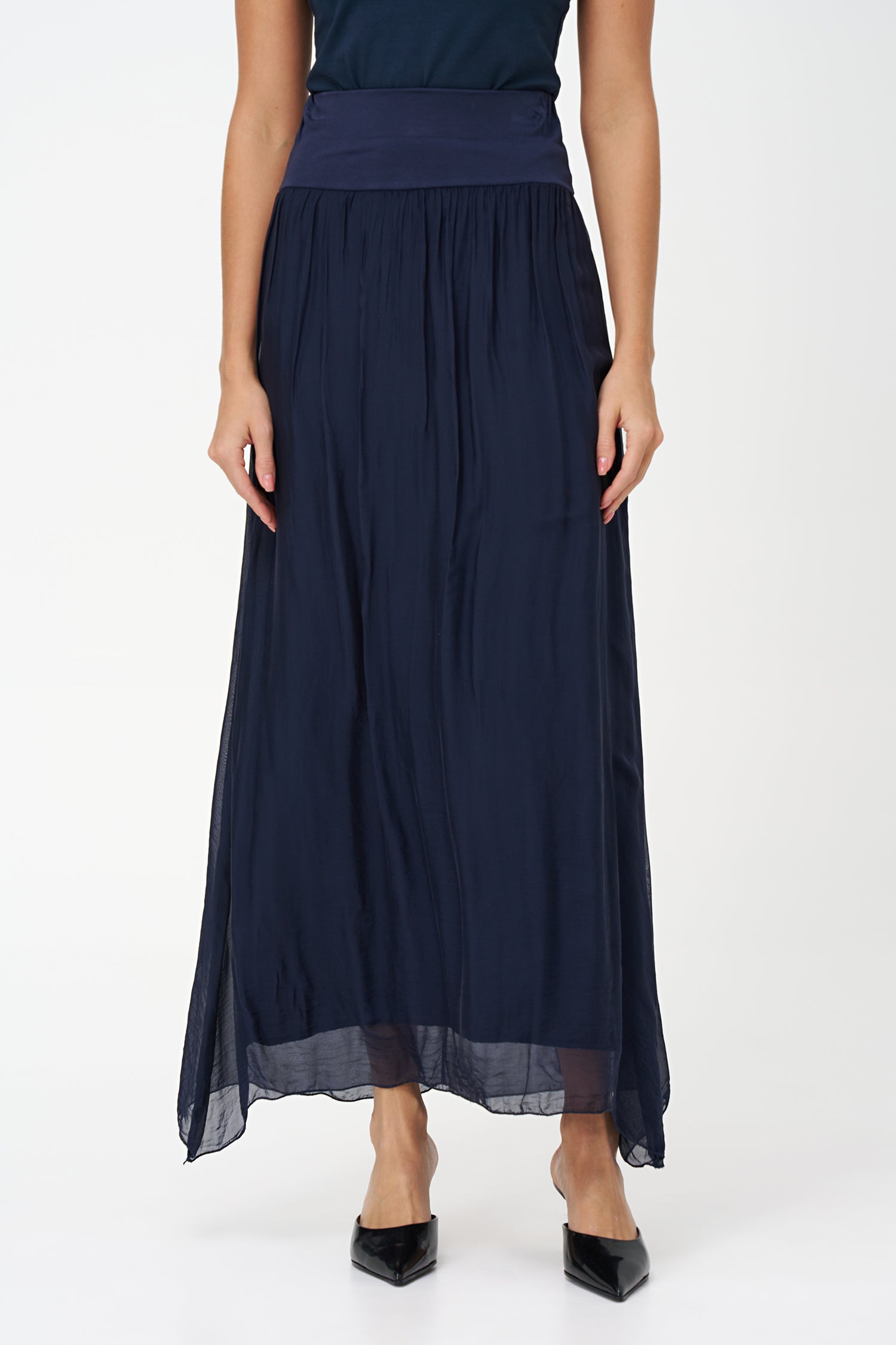 Blue flowy maxi skirt in semi-sheer viscose-silk blend with wide smocked waistband, perfect for summer occasions and beach getaways.