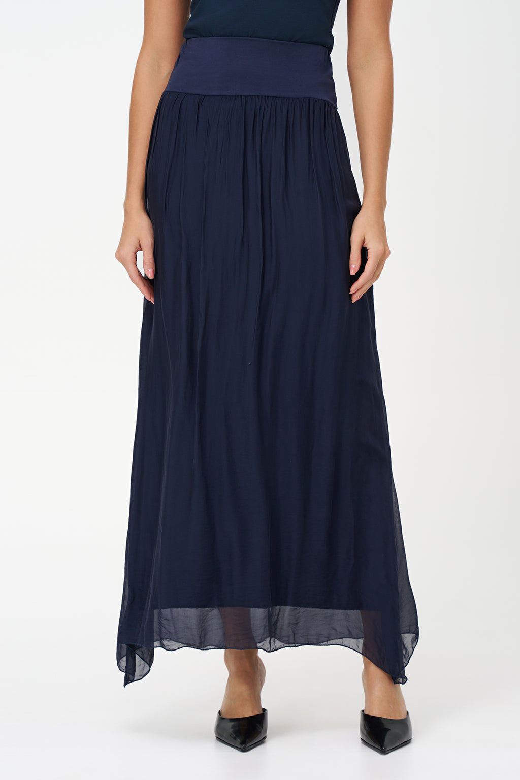Blue flowy maxi skirt in semi-sheer viscose-silk blend with wide smocked waistband, perfect for summer occasions and beach getaways.