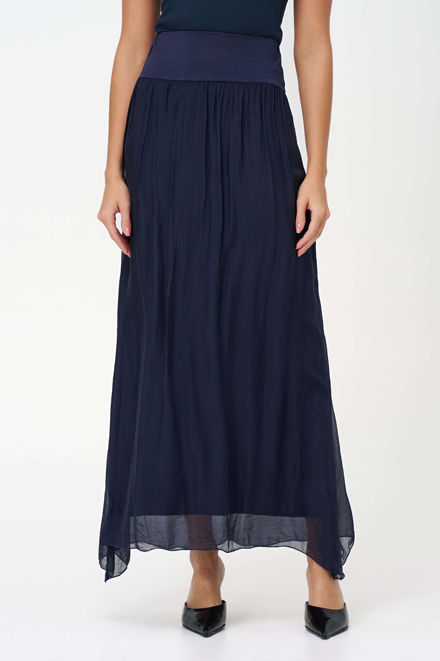 Blue flowy maxi skirt in semi-sheer viscose-silk blend with wide smocked waistband, perfect for summer occasions and beach getaways.