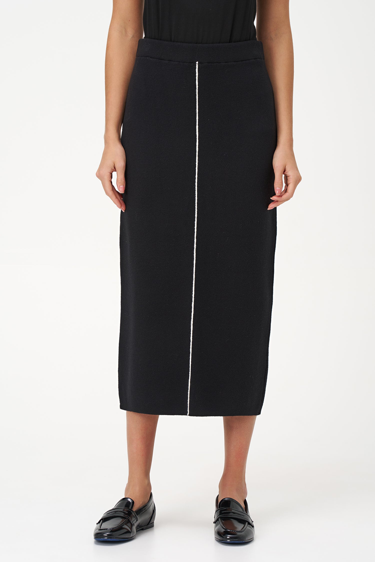 Black knit pencil skirt with front contrast seam detail, crafted in soft stretch rayon blend for a sleek, modern silhouette.