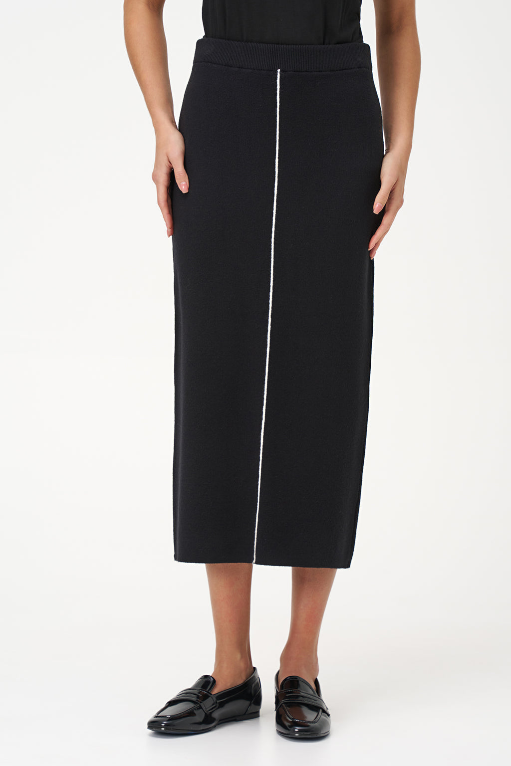 Black knit pencil skirt with front contrast seam detail, crafted in soft stretch rayon blend for a sleek, modern silhouette.