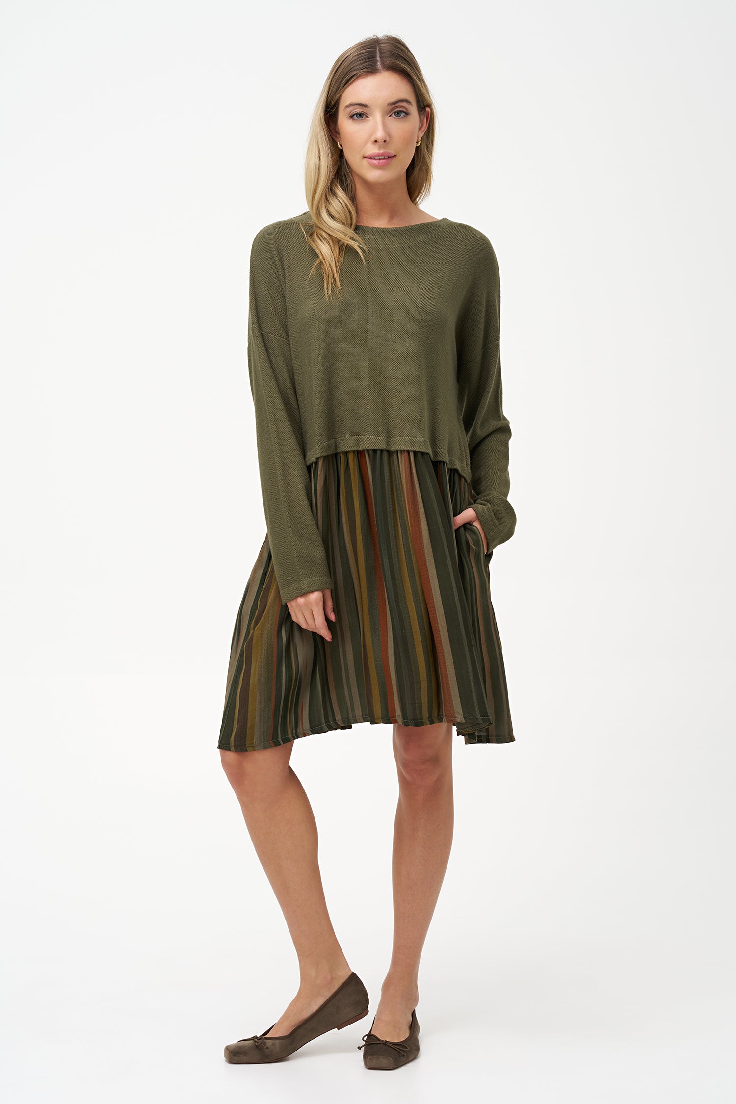 Two-tone long sleeve dress with solid olive knit top and striped flared skirt in earthy tones.