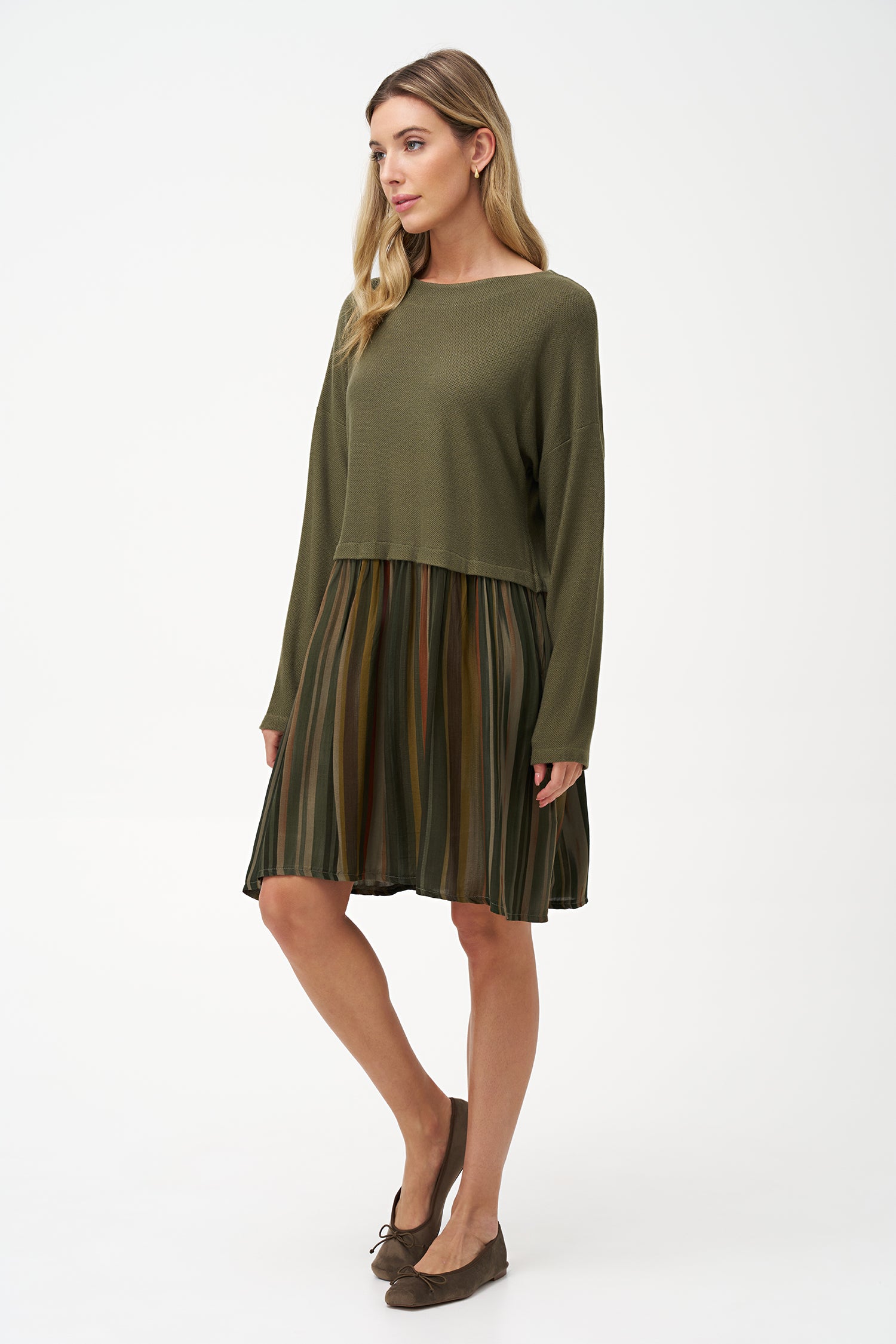 Two-tone long sleeve dress with solid olive knit top and striped flared skirt in earthy tones.