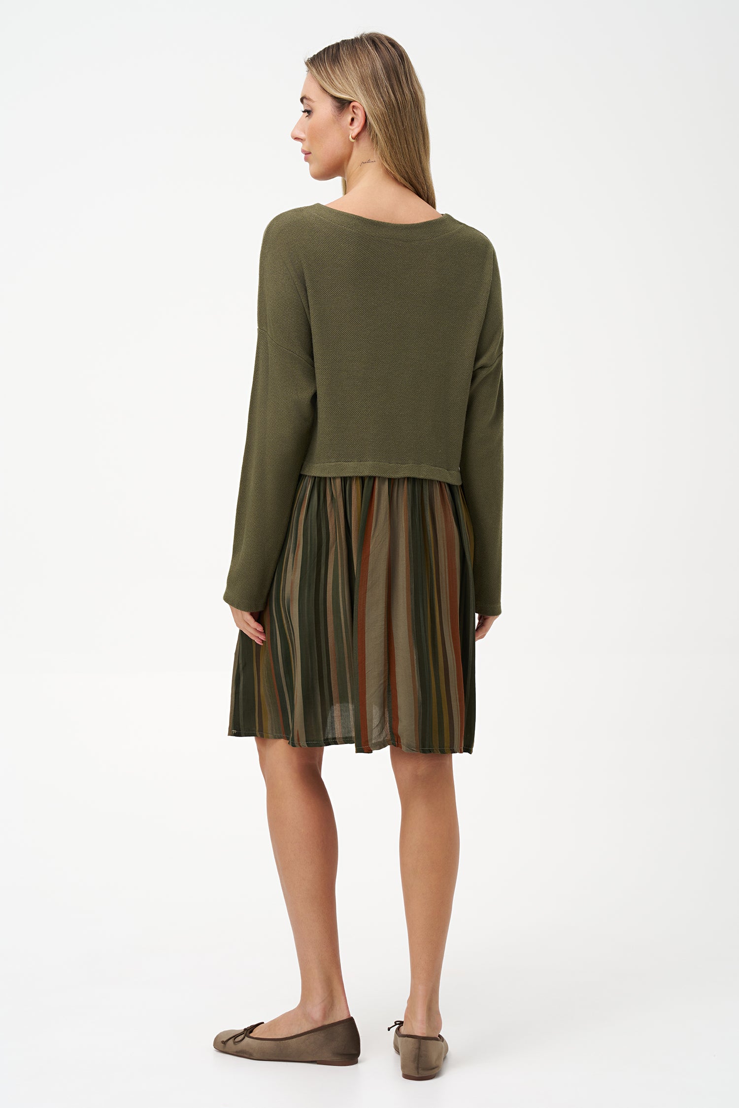 Two-tone long sleeve dress with solid olive knit top and striped flared skirt in earthy tones.