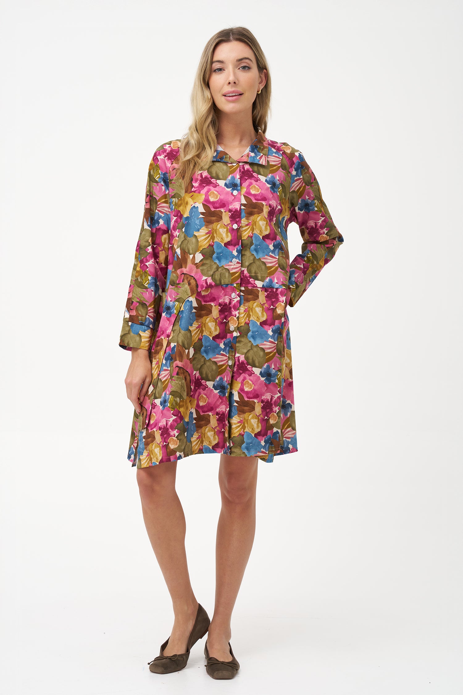 Long-sleeve button-front shirt dress with pink floral bouquet print and pointed collar.