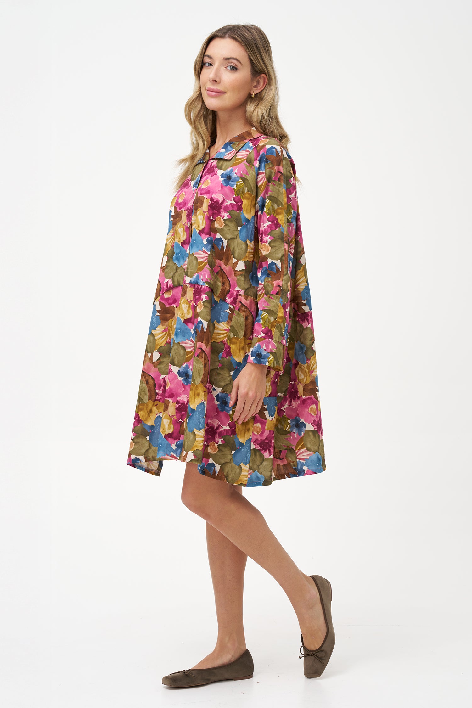 Long-sleeve button-front shirt dress with pink floral bouquet print and pointed collar.