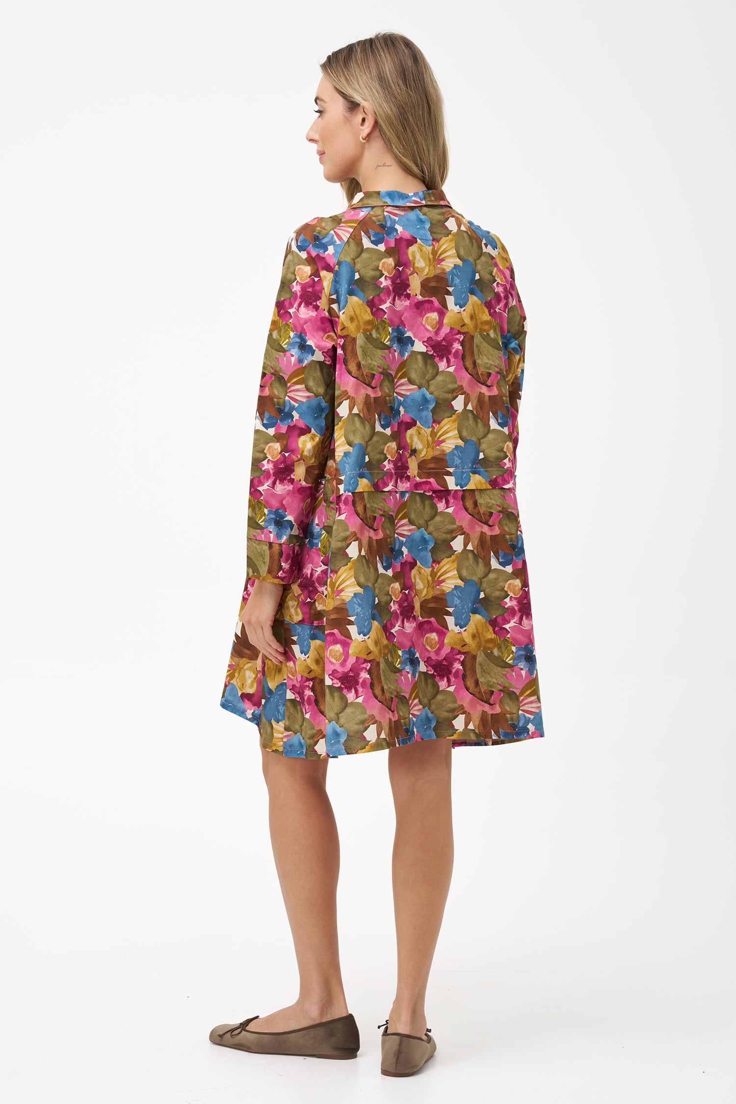 Long-sleeve button-front shirt dress with pink floral bouquet print and pointed collar.