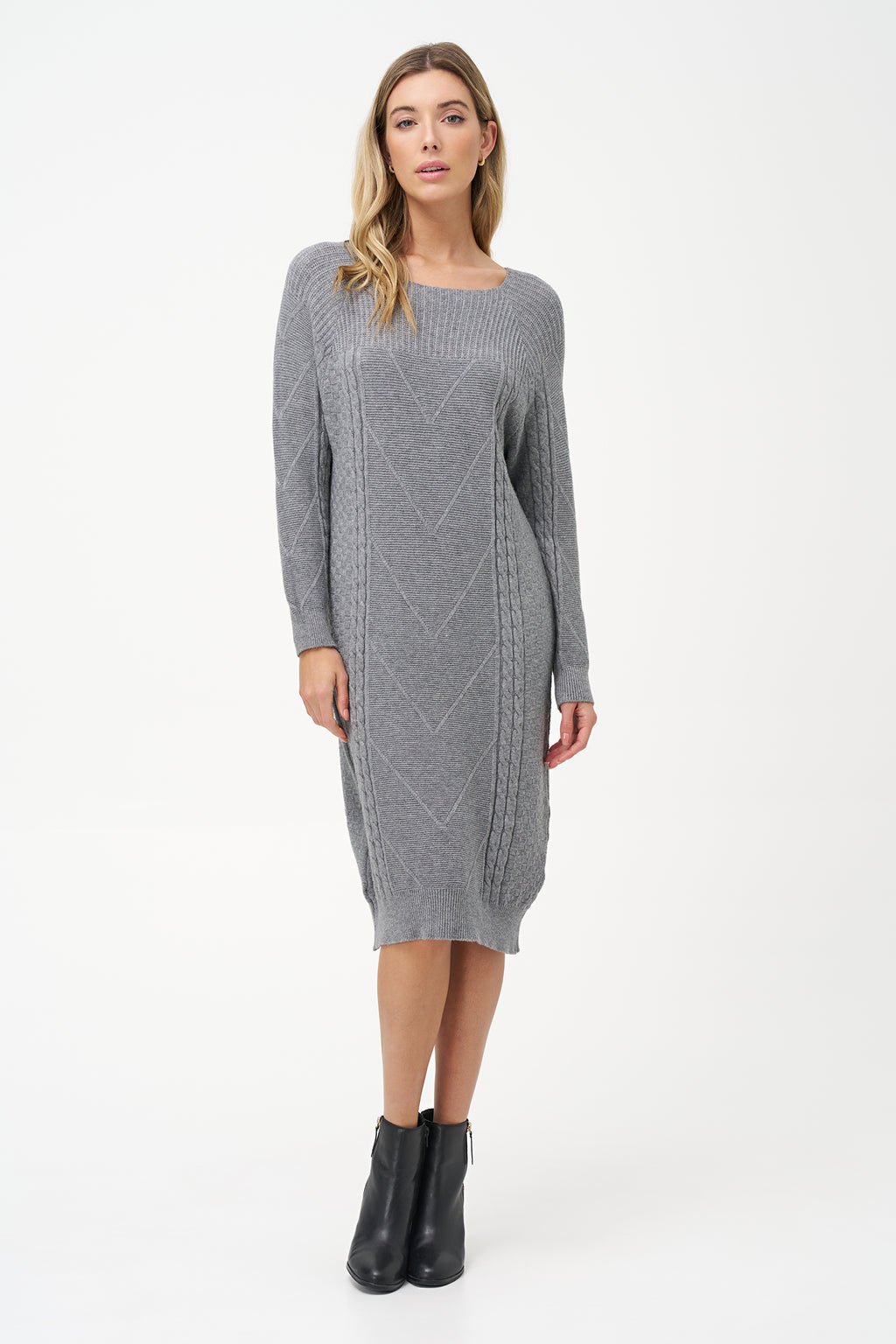 Grey cable knit sweater dress with long sleeves and ribbed hemline.