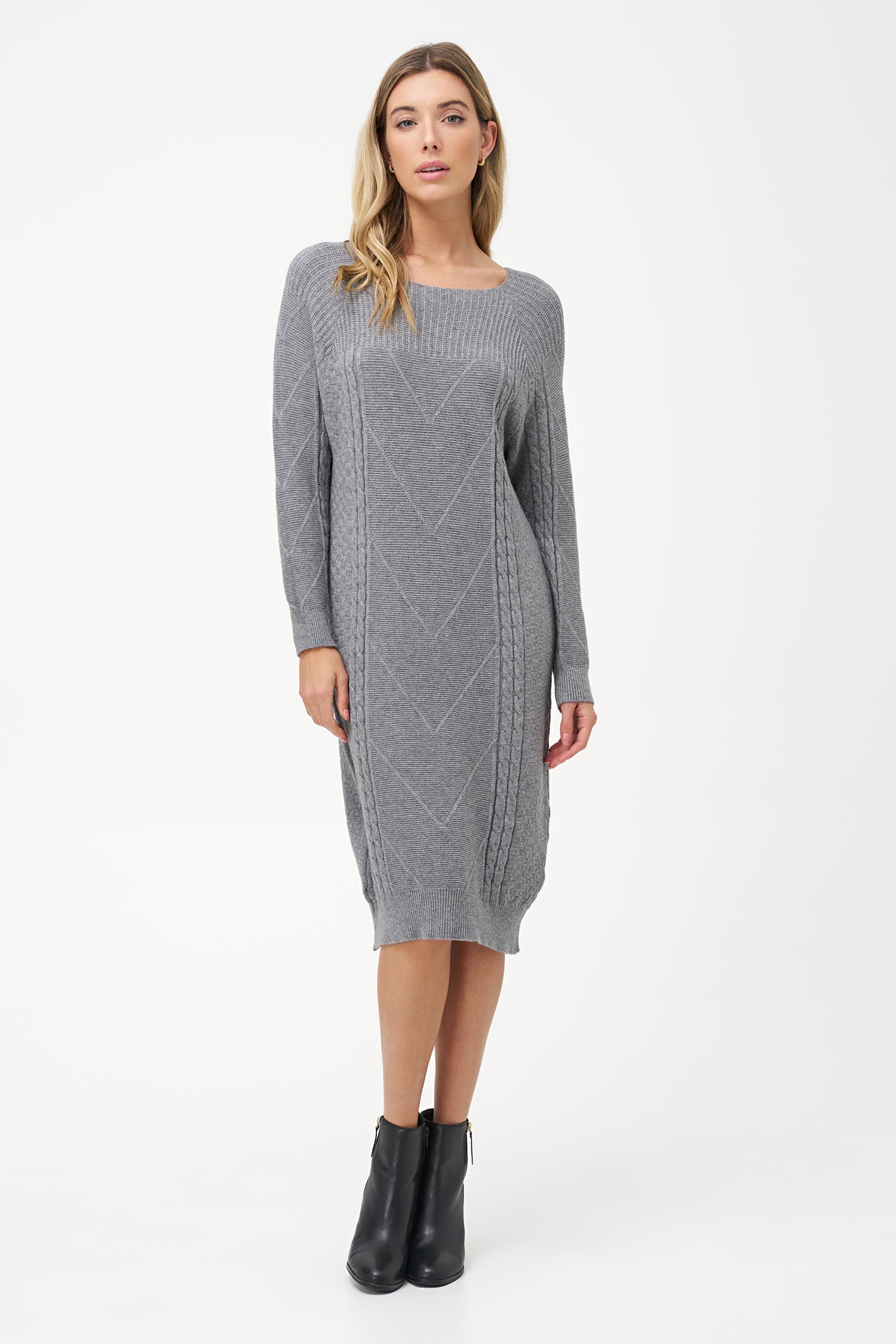 Grey cable knit sweater dress with long sleeves and ribbed hemline.