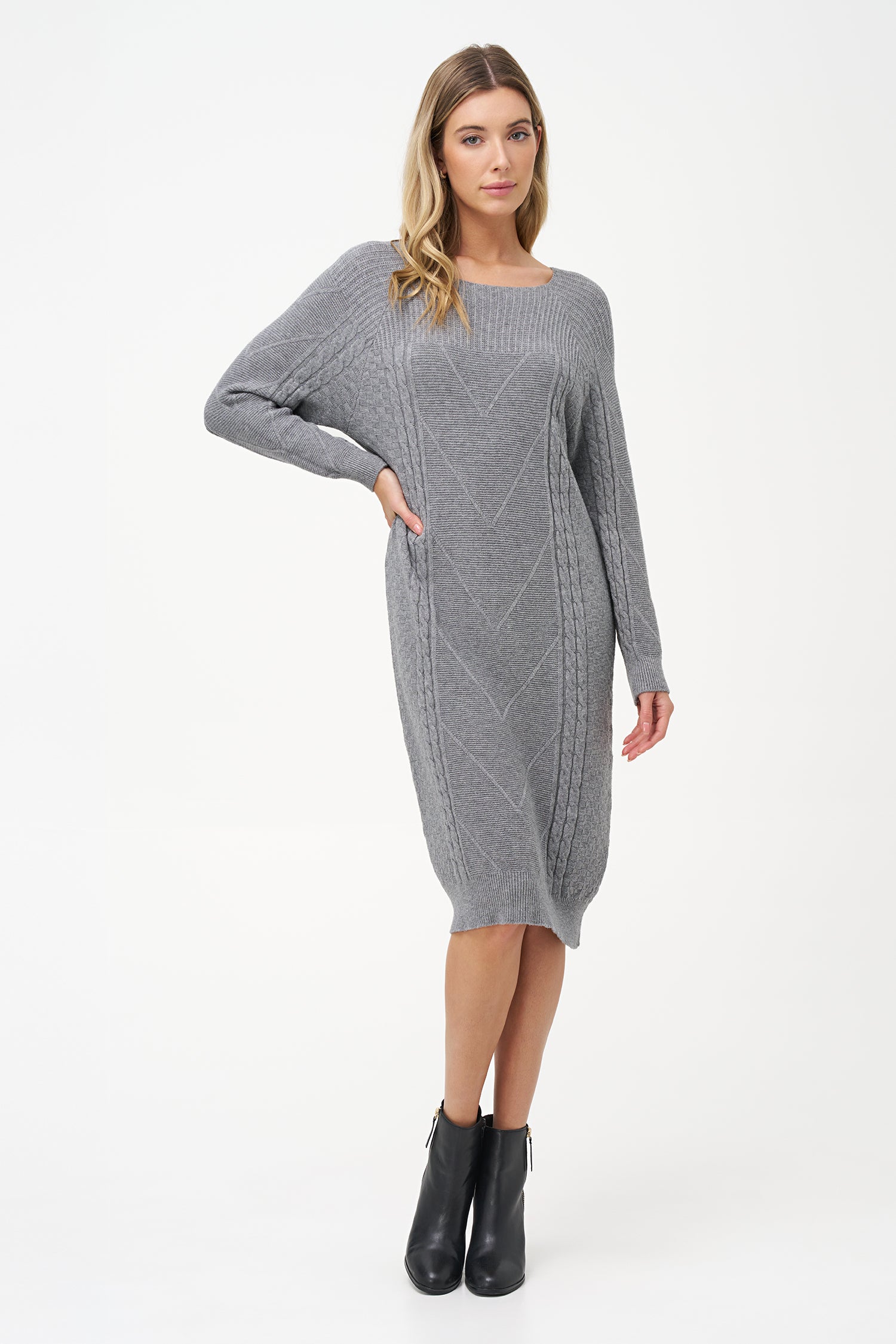 Grey cable knit sweater dress with long sleeves and ribbed hemline.