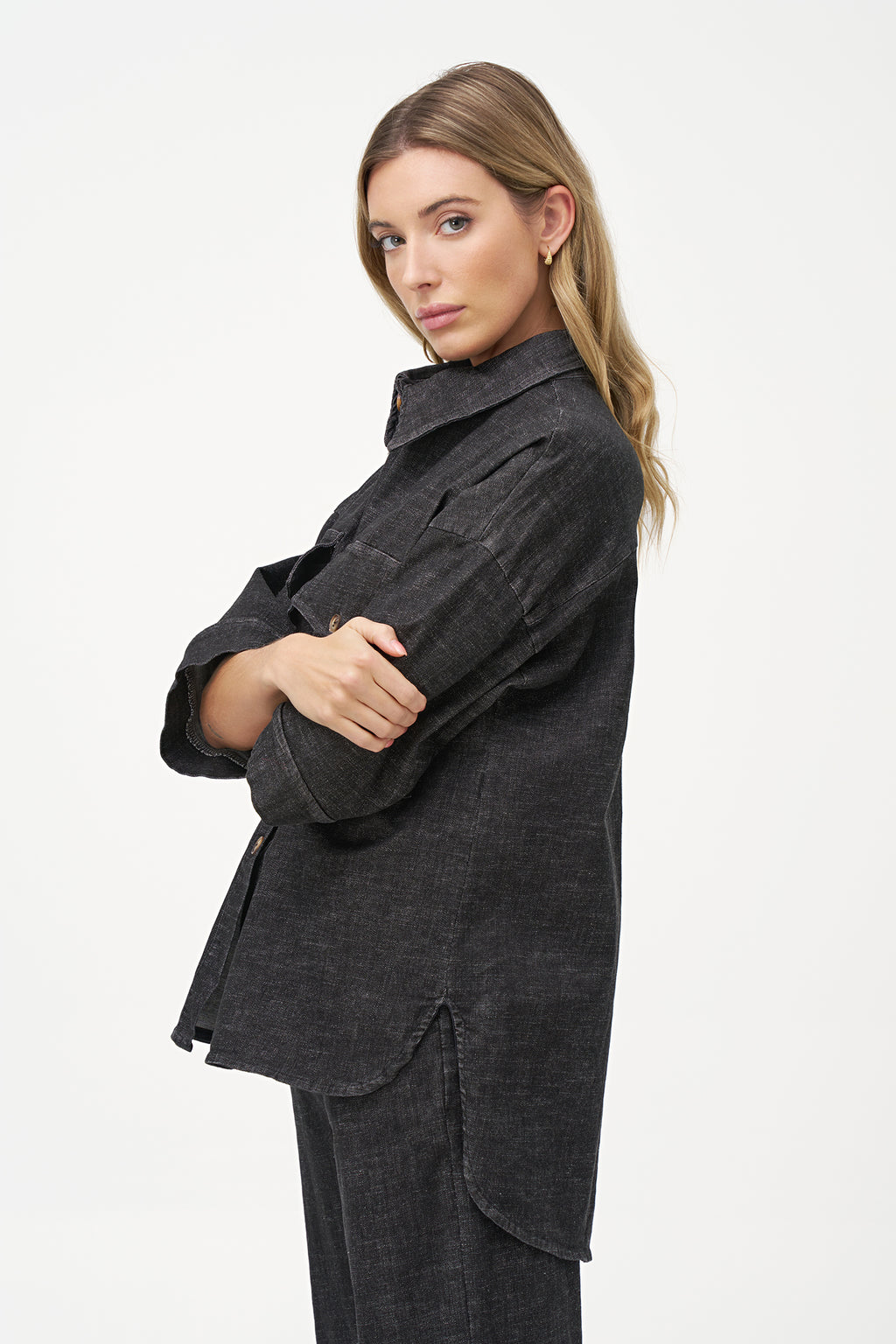 Black denim shirt with wooden buttons, front flap pockets, and 3/4 sleeves