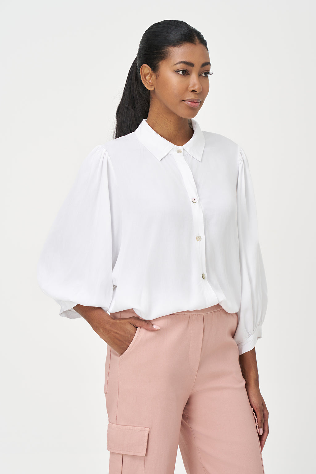 White button-up blouse with relaxed fit, long sleeves, and soft drape