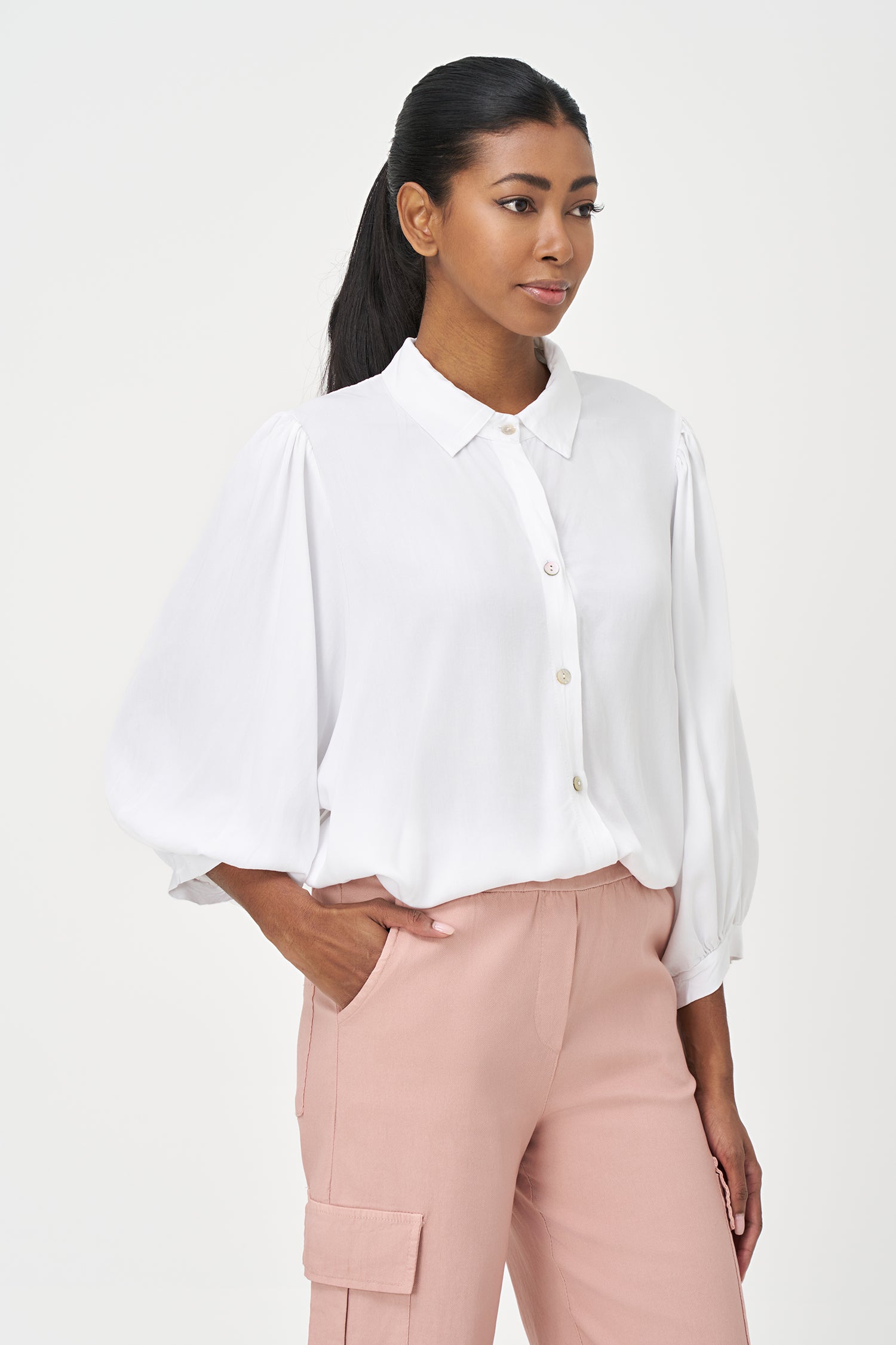 White button-up blouse with relaxed fit, long sleeves, and soft drape