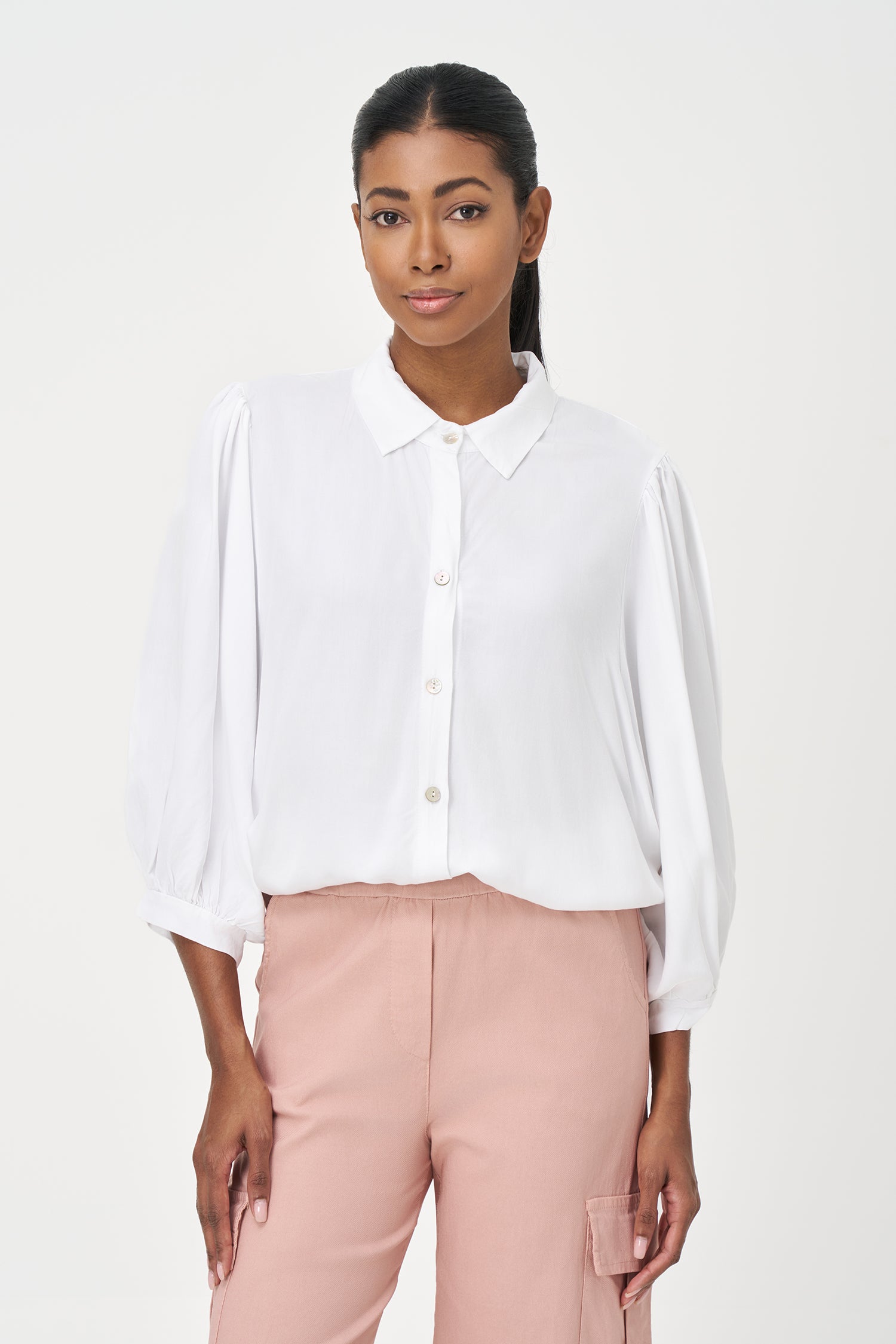 White button-up blouse with relaxed fit, long sleeves, and soft drape