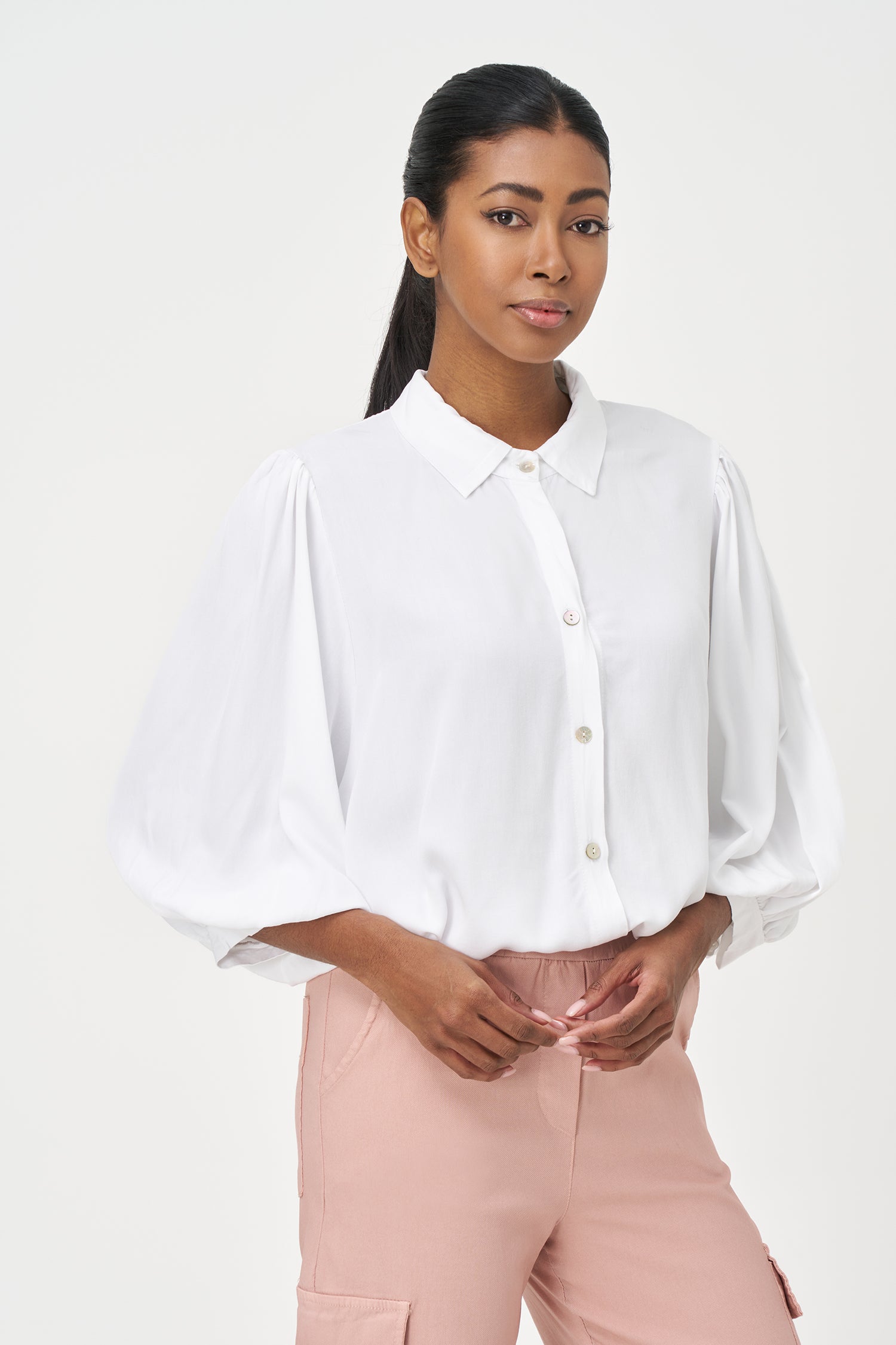 White button-up blouse with relaxed fit, long sleeves, and soft drape