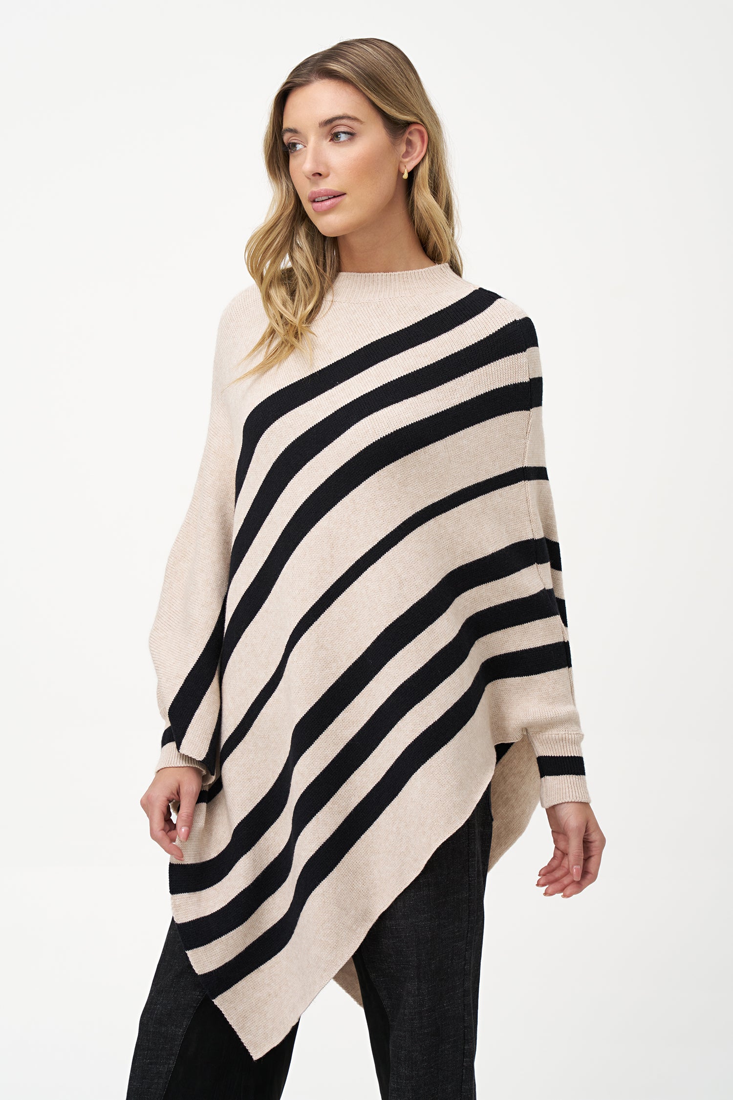 White asymmetrical poncho with beige diagonal stripes and ribbed neckline