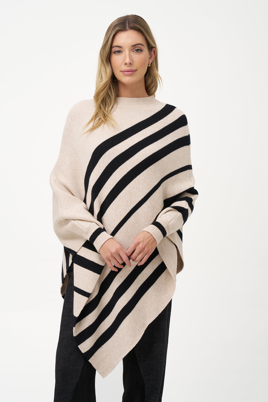 White asymmetrical poncho with beige diagonal stripes and ribbed neckline