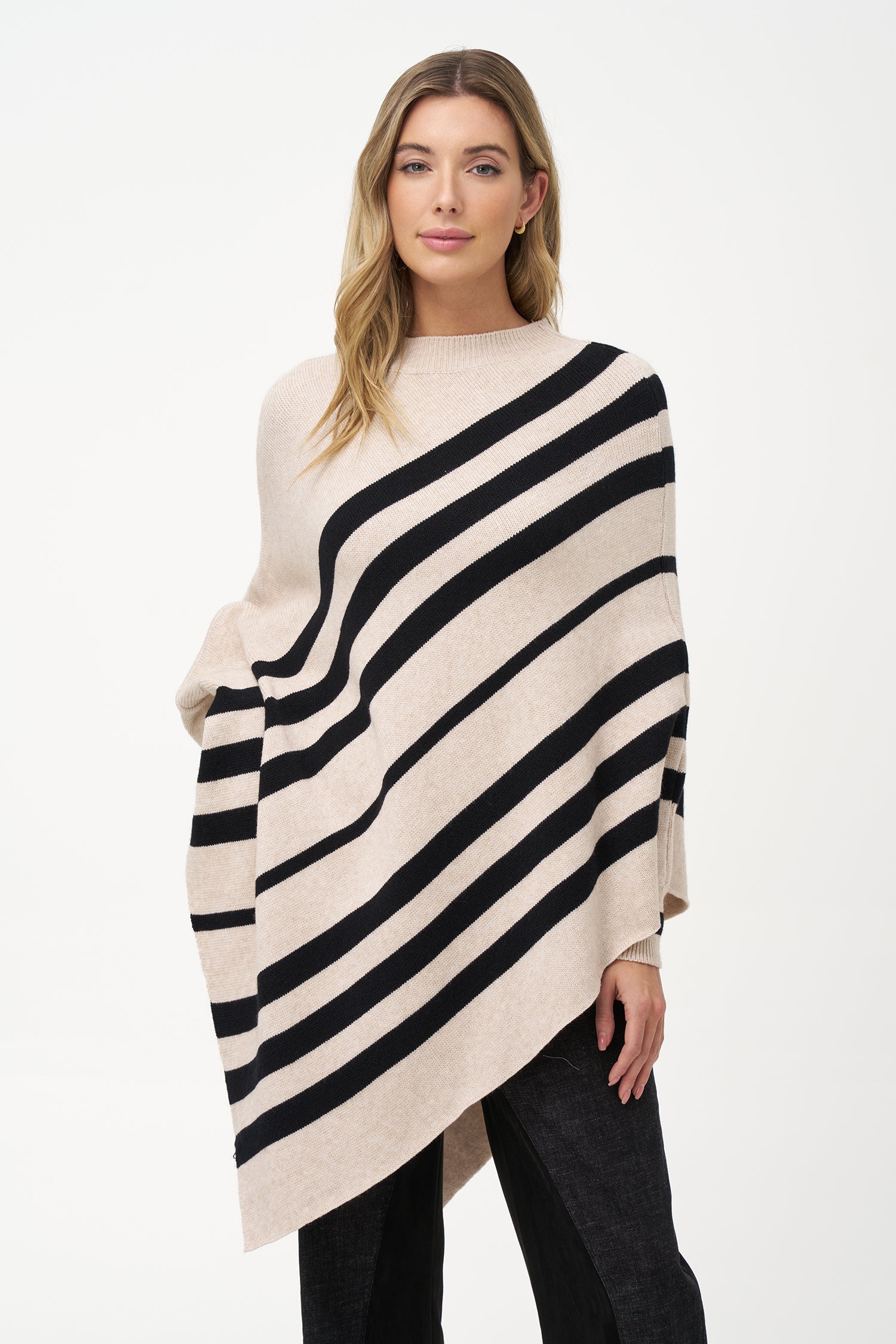 White asymmetrical poncho with beige diagonal stripes and ribbed neckline