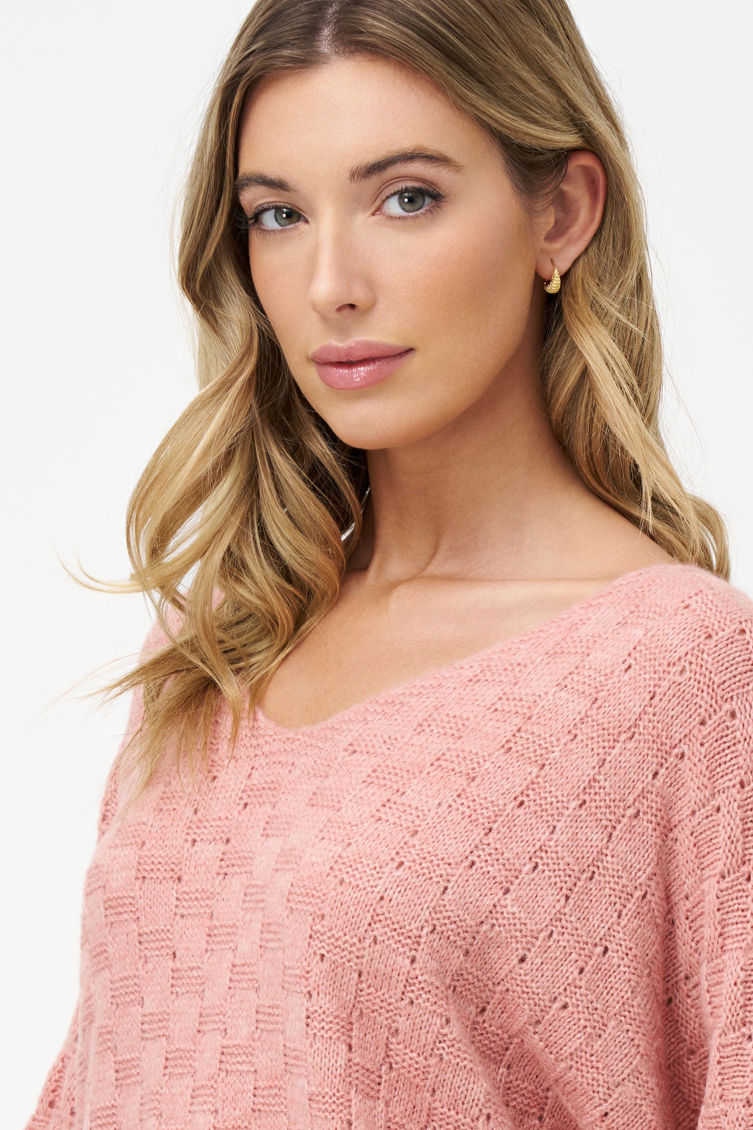 Beige knit women's sweater with V-neck and half sleeves, crafted from acrylic and wool blend for cozy, breathable texture.
