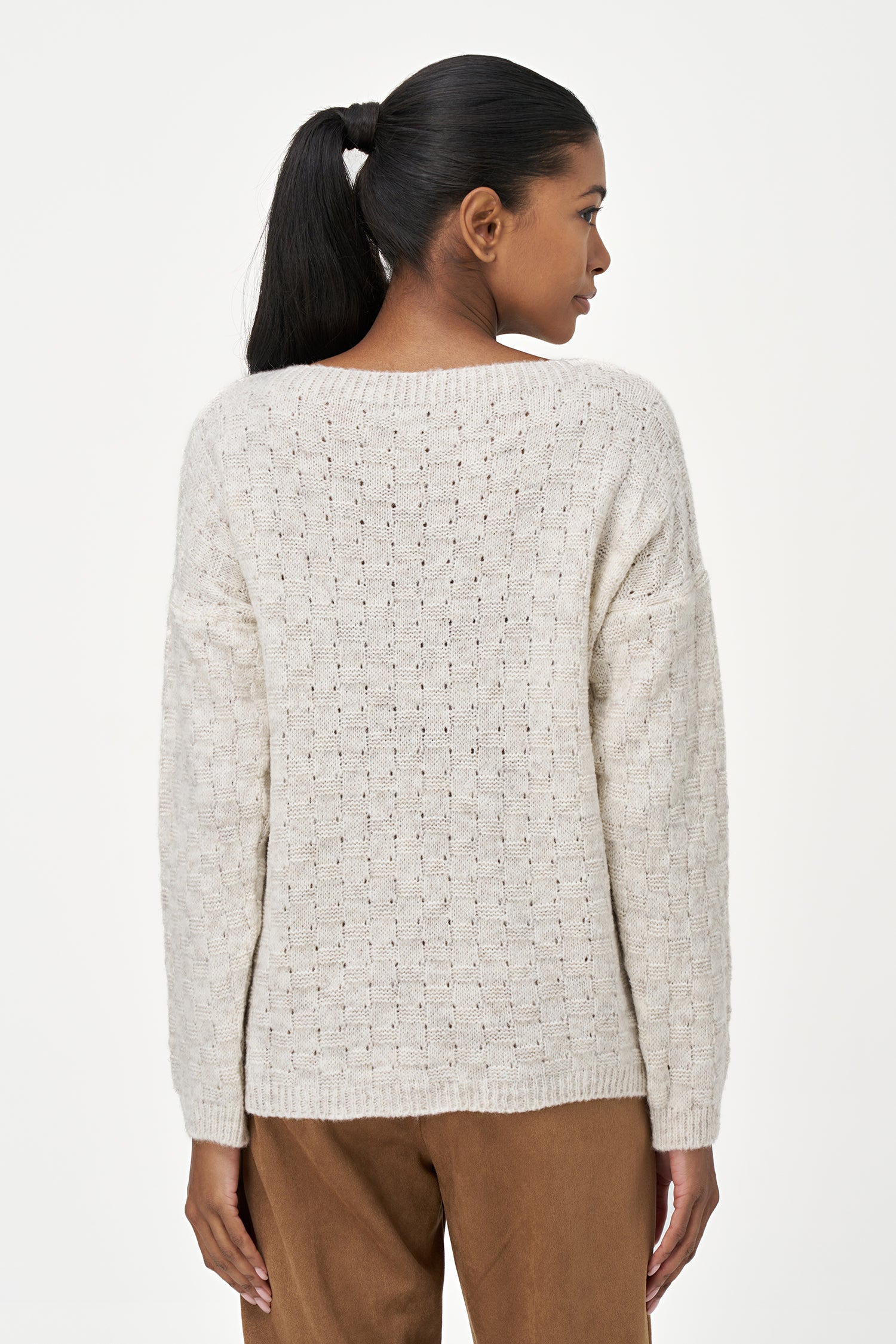 White long sleeve women's sweater with textured knit design, made from soft acrylic and wool blend for cozy everyday wear.