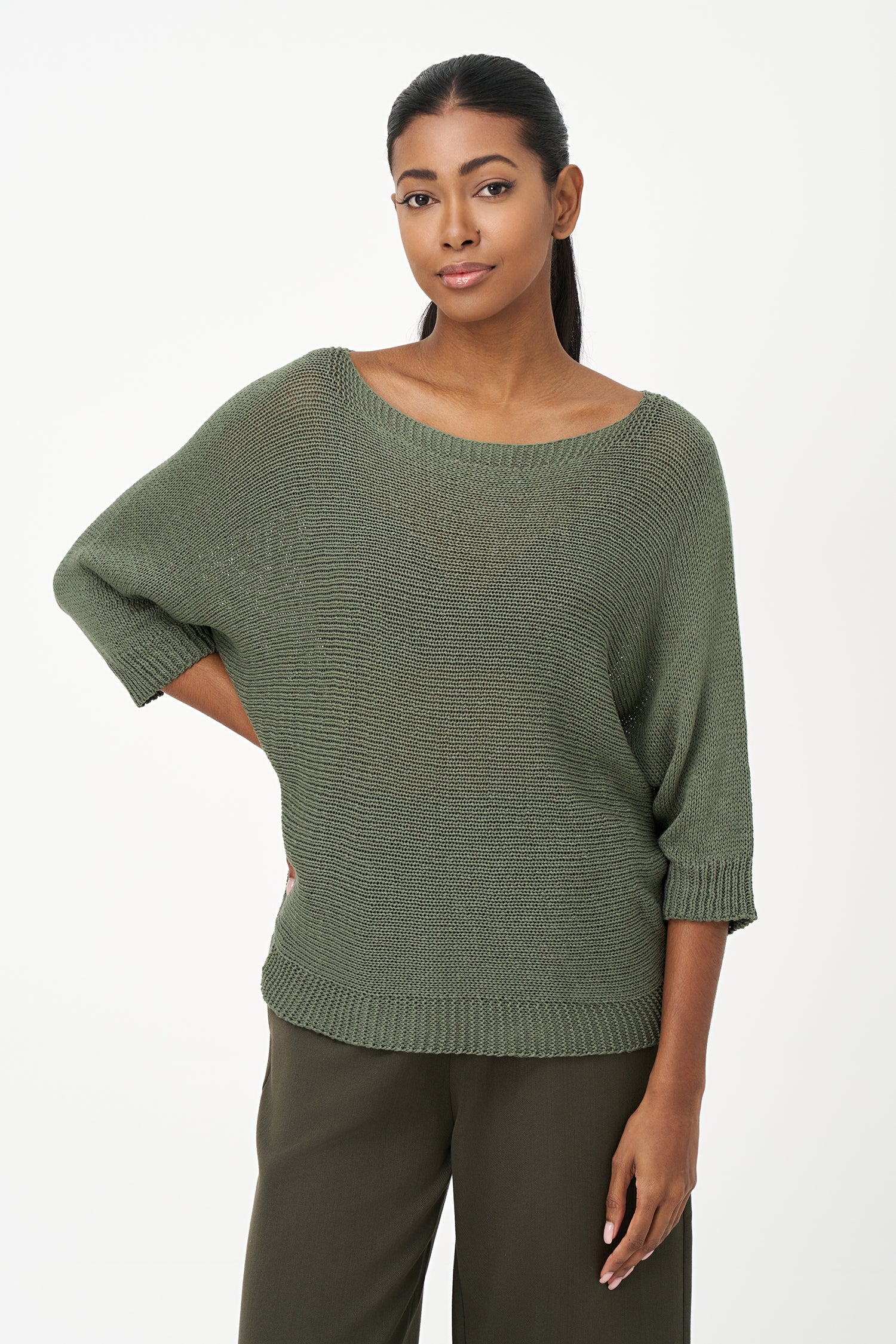 Brown ribbed acrylic sweater with soft knit texture and relaxed fit, perfect for cool days and layering in casual or dressy looks.
