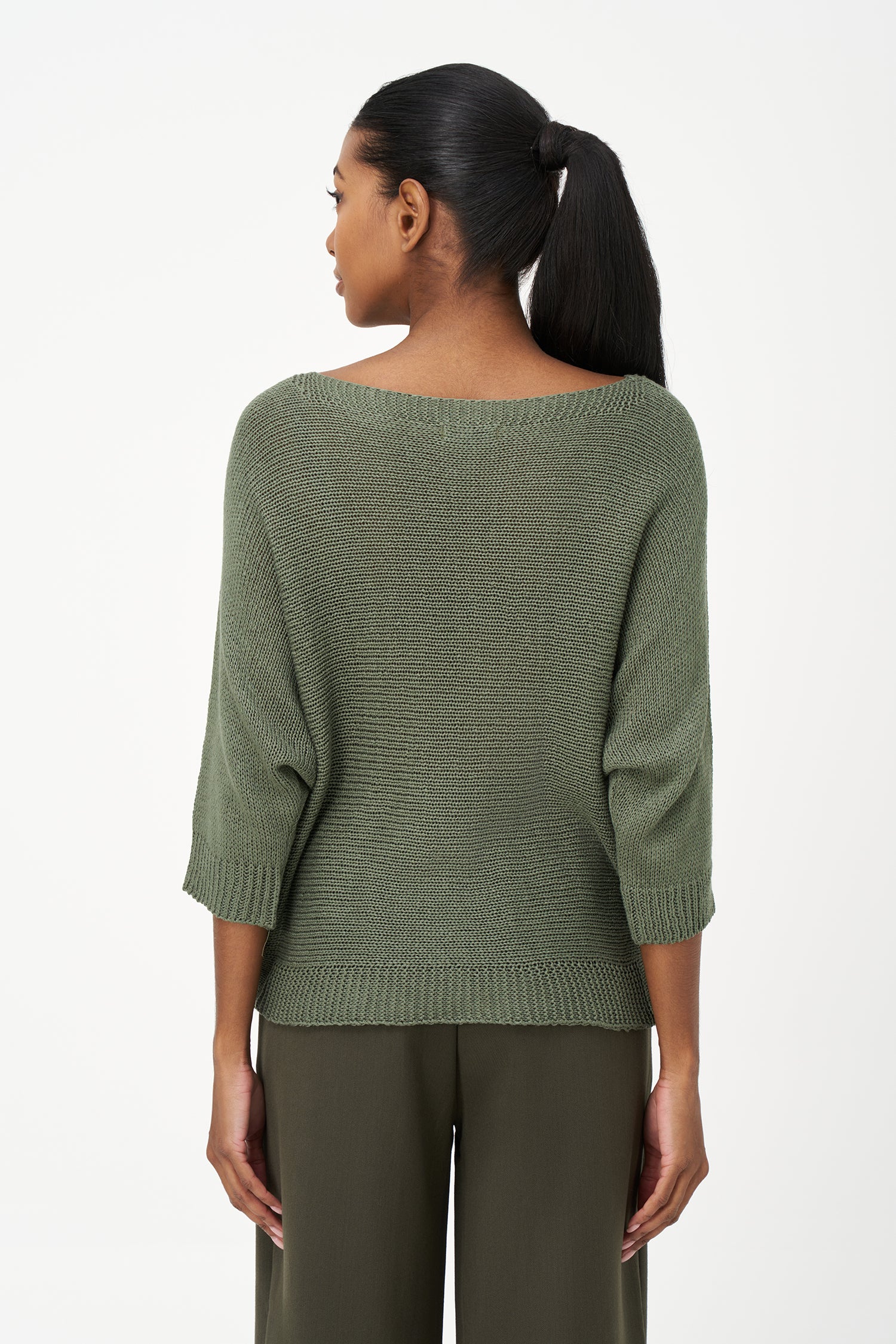 Brown ribbed acrylic sweater with soft knit texture and relaxed fit, perfect for cool days and layering in casual or dressy looks.